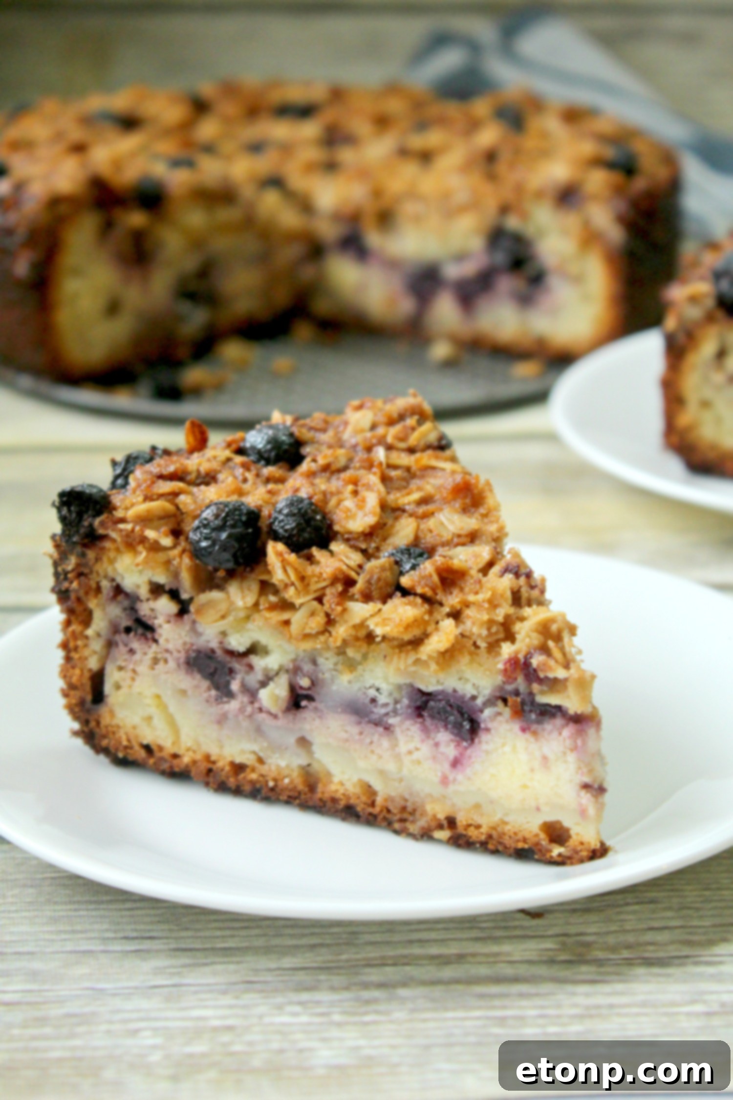 Eight delicious slices of blueberry cream cheese coffeecake arranged on a platter.