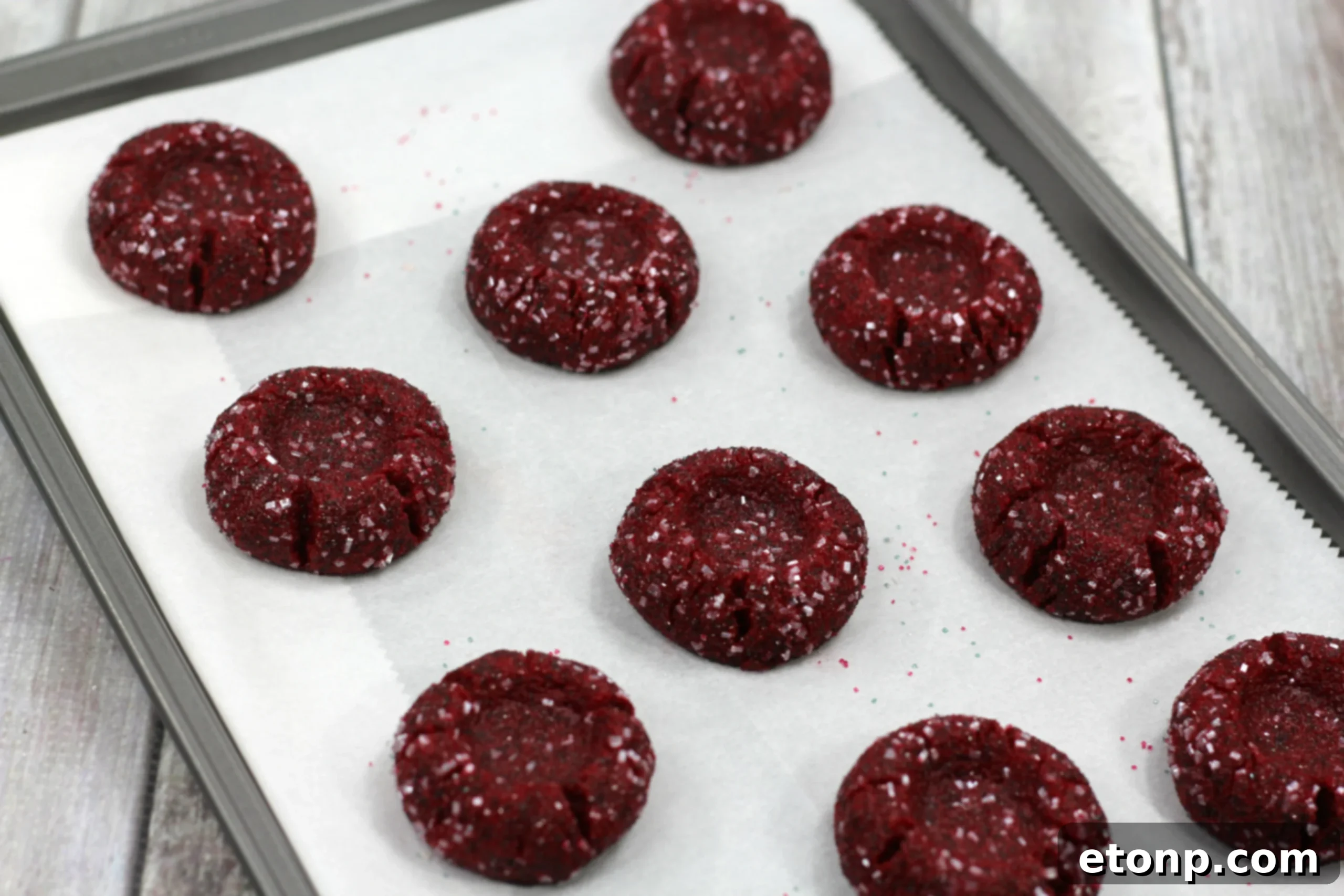 Decadent Red Velvet Cheesecake Thumbprints 4 Close-up shot emphasizing the creamy cheesecake filling in the center of a Red Velvet cookie.