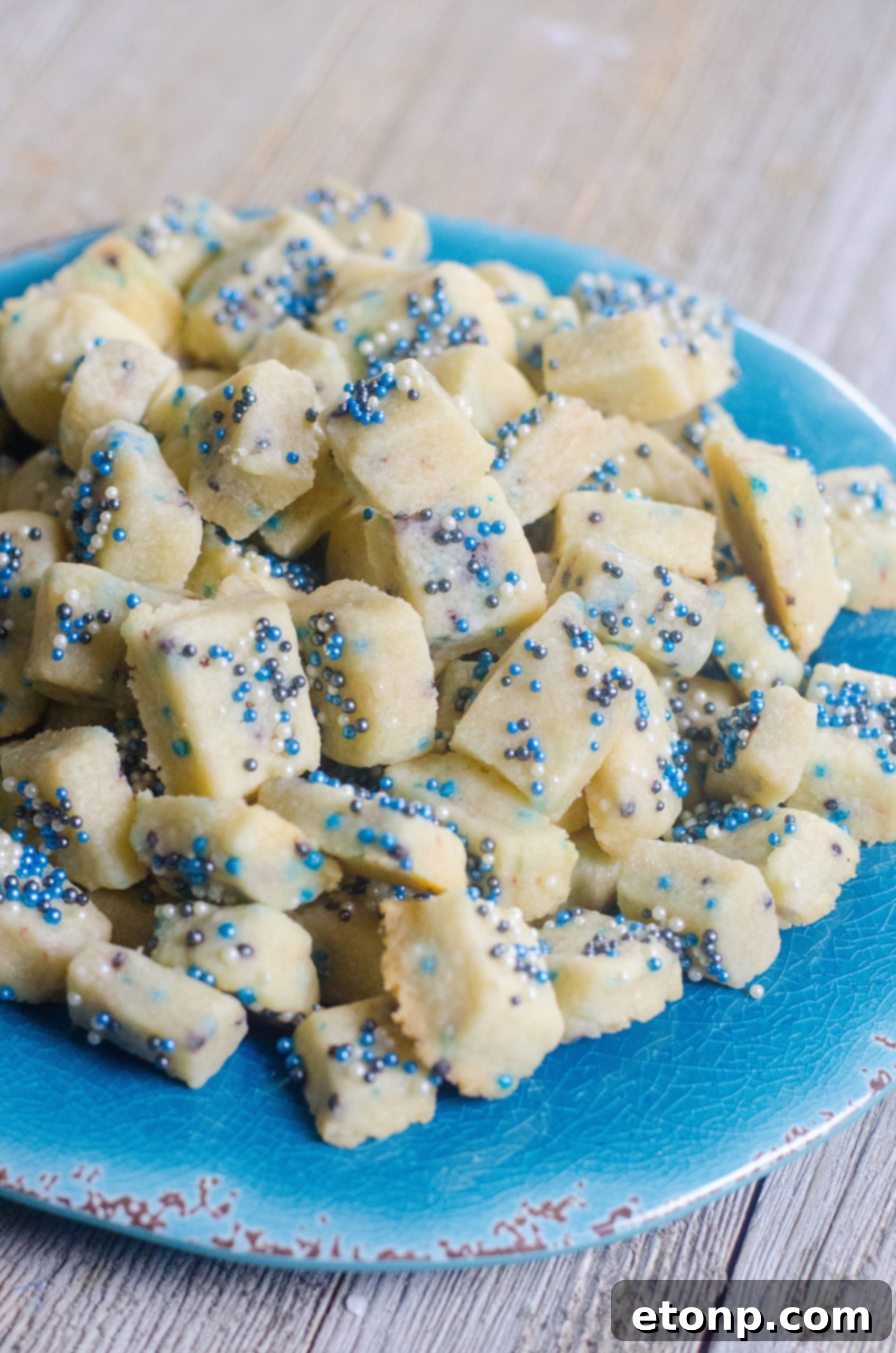 A large batch of freshly baked Winter Shortbread Bites cooling on a rack, ready for storage or immediate enjoyment.