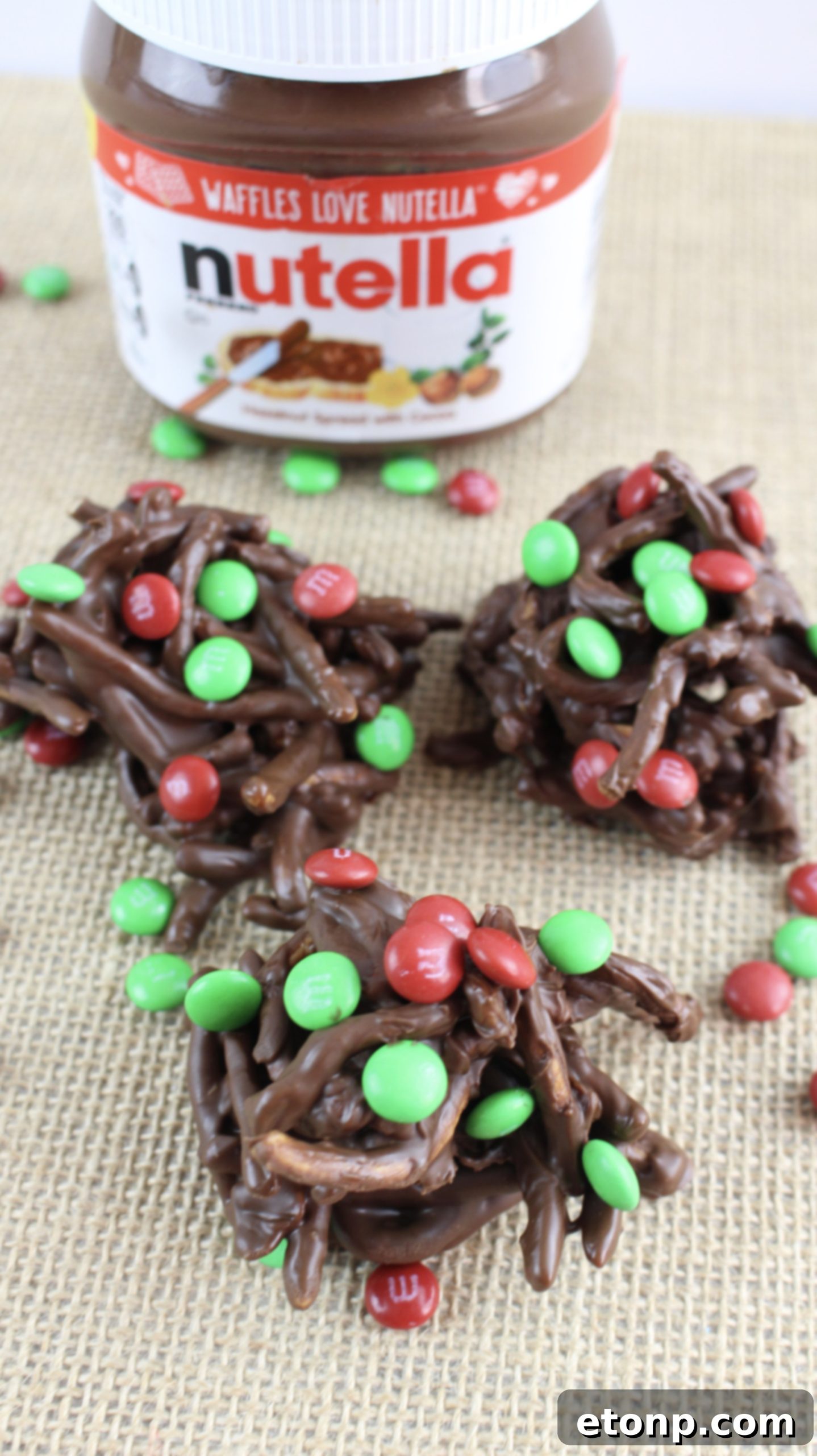 A bowl filled with various holiday chocolate haystacks, ready for serving or gifting.