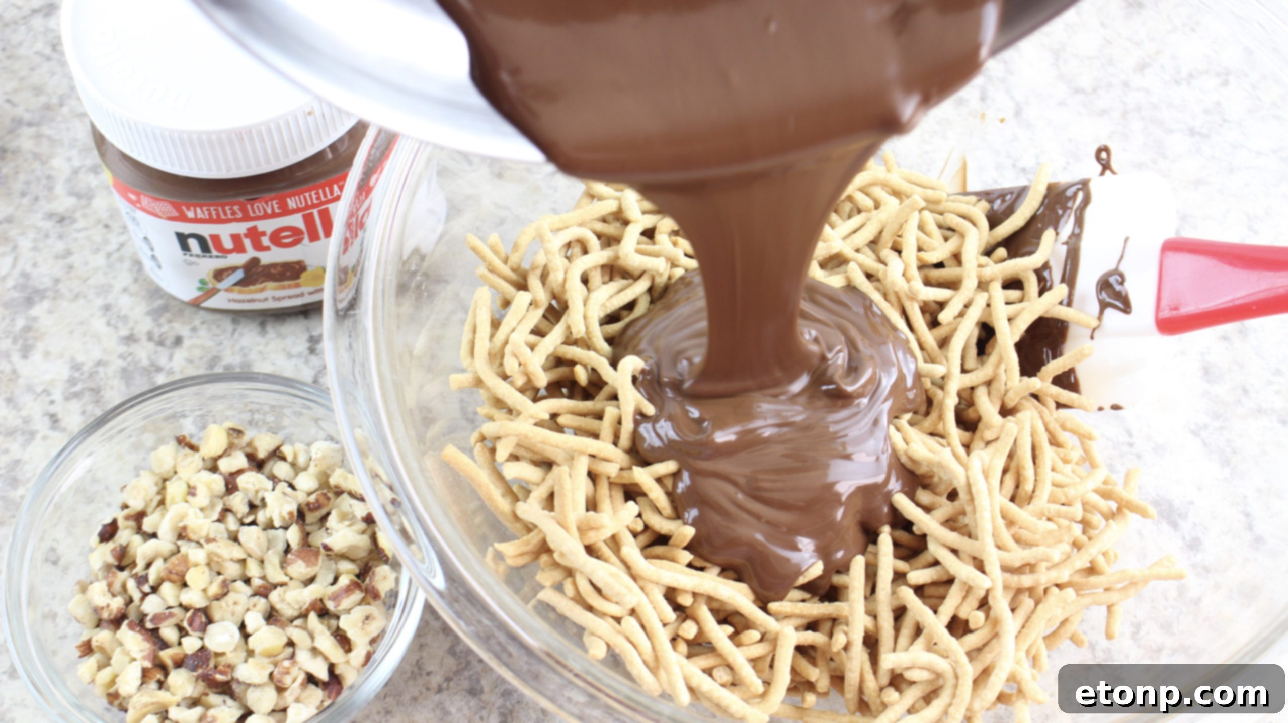 Ingredients for chocolate haystacks: chocolate chips, Nutella, chow mein noodles, and nuts.