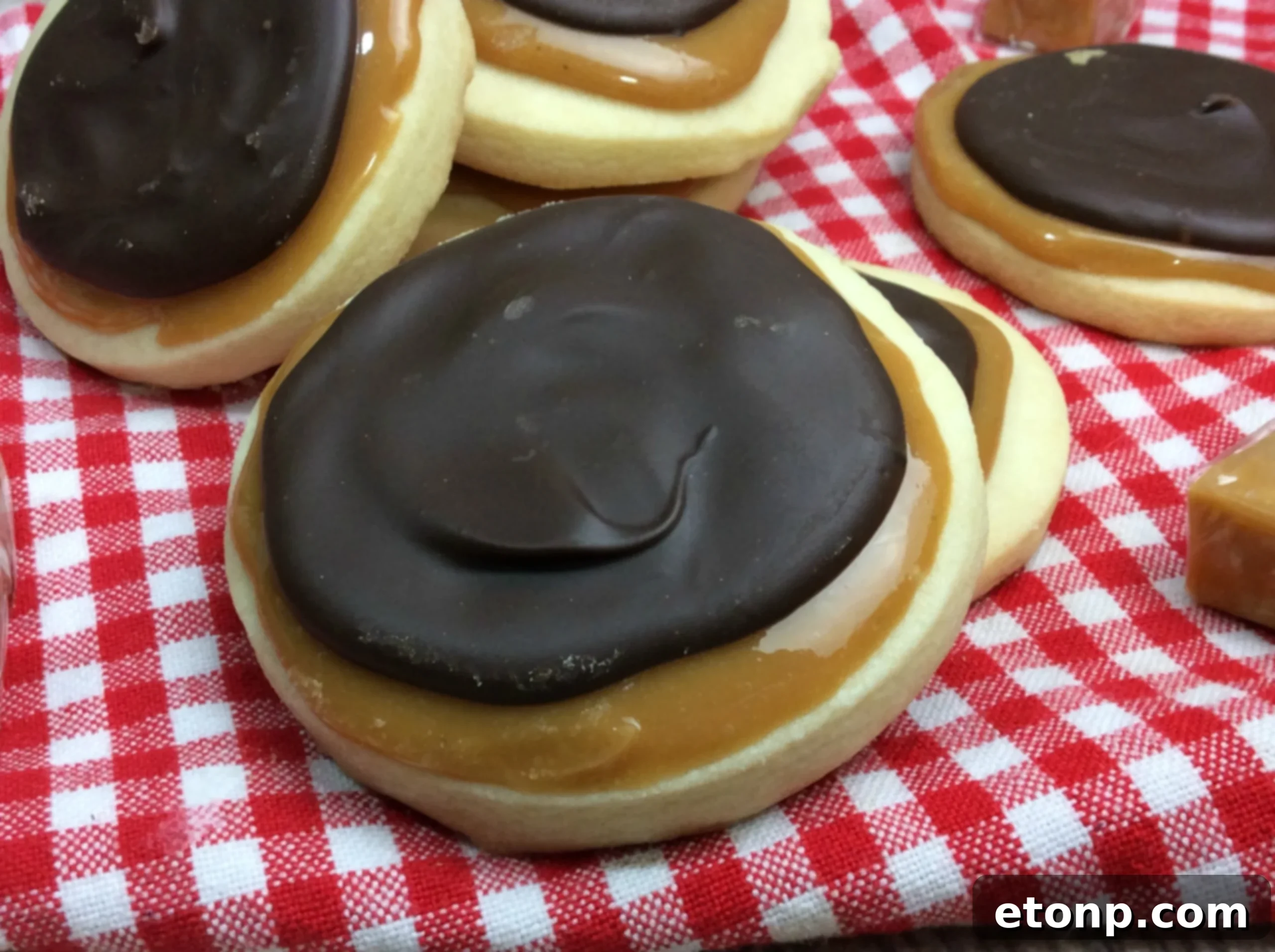 Copycat Twix Cookies 4 An array of freshly baked Twix-inspired cookies arranged artistically on a platter, ready for guests.