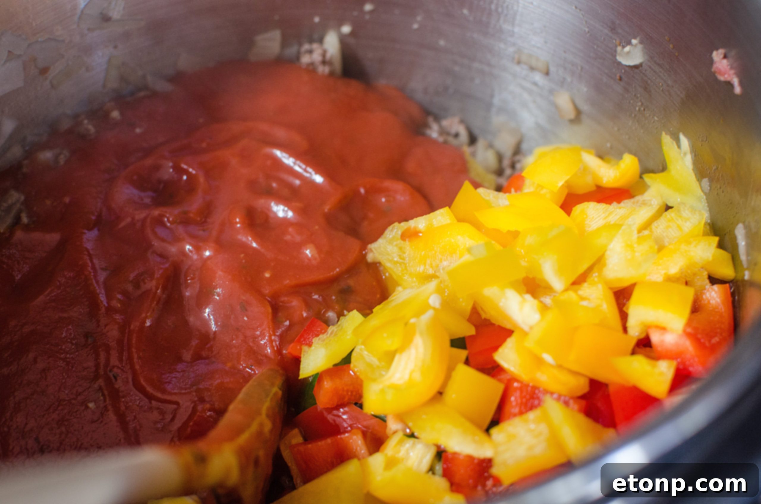 Stuffed Pepper Soup in a white bowl, garnished with fresh parsley, highlighting the vibrant colors and hearty ingredients.