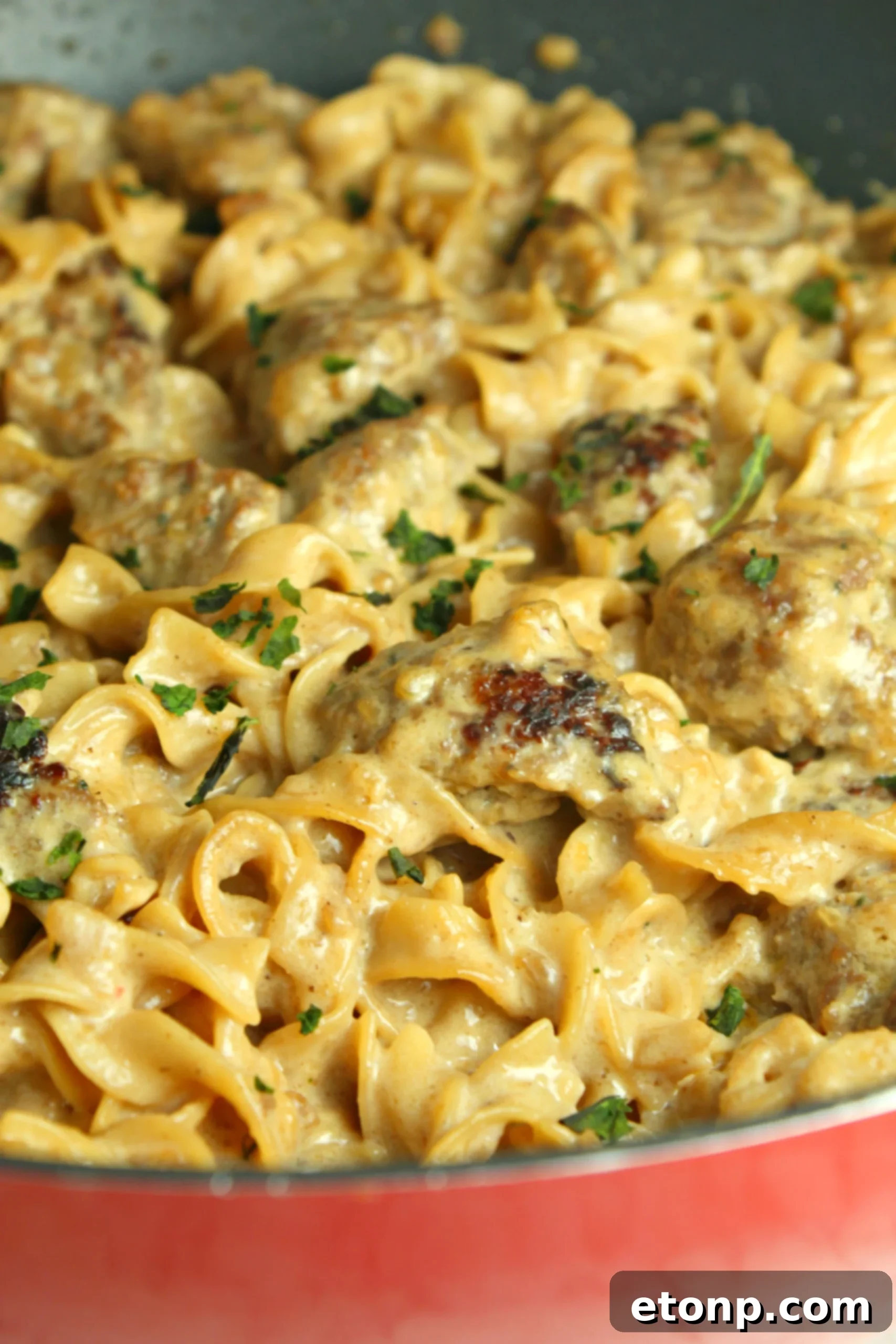 Delicious Creamy French Onion Sausage Pasta in a large pot, ready to serve