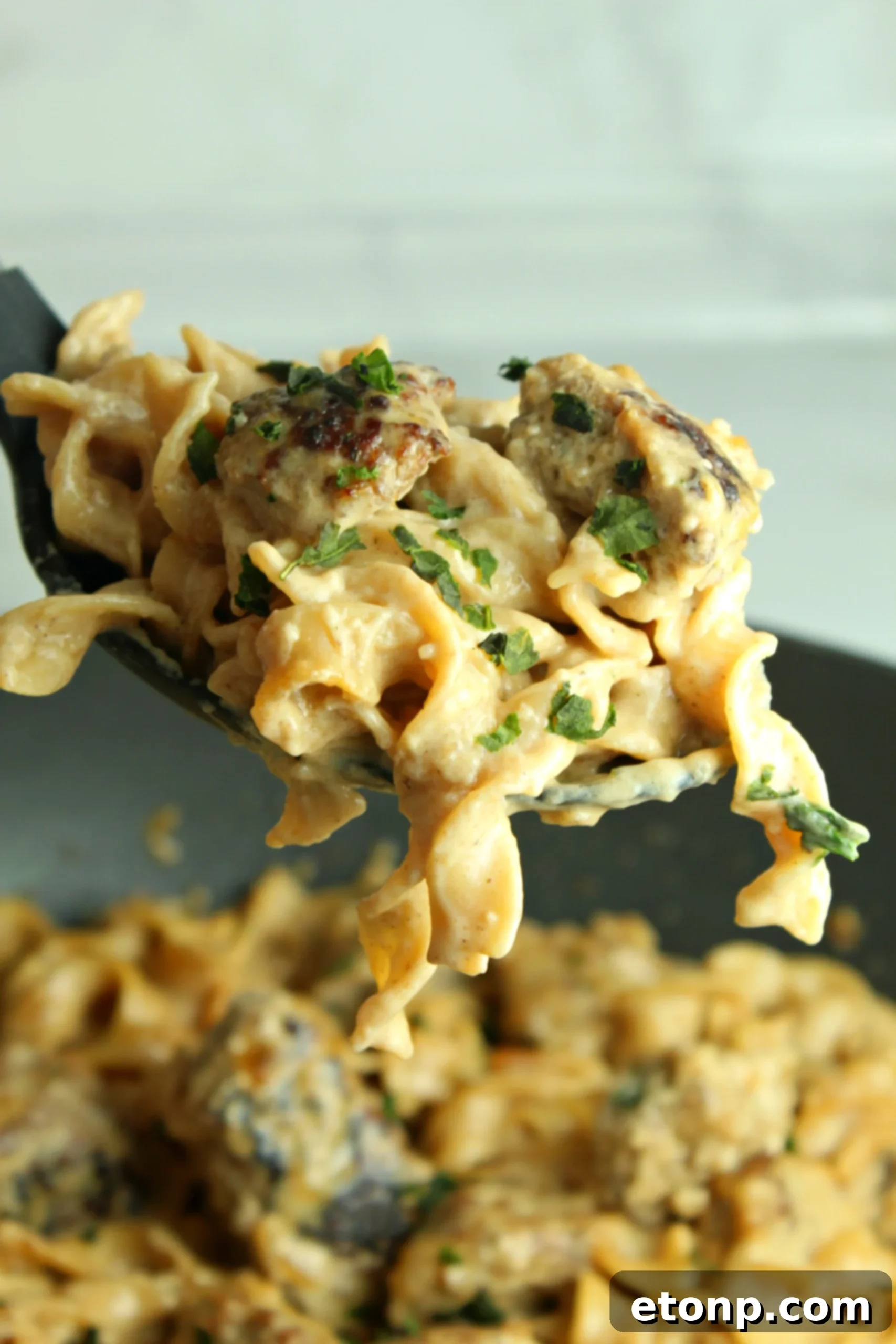 A large pot filled with freshly cooked Creamy French Onion Sausage Pasta