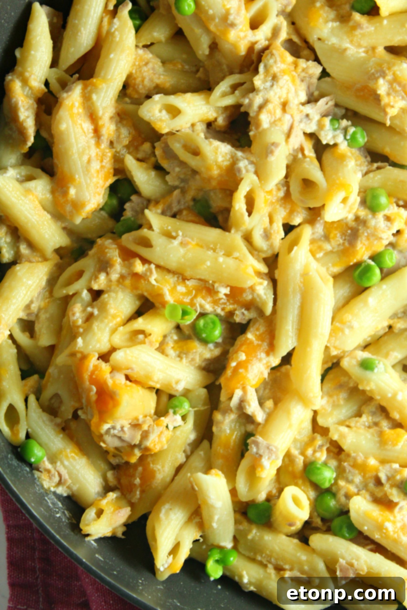 Cheesy Tuna Casserole with green peas, highlighting vegetable addition options