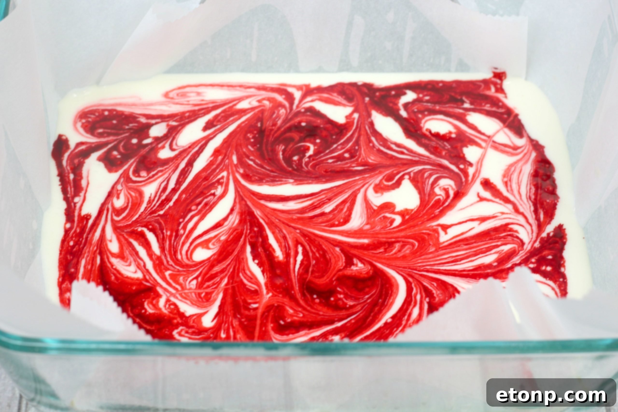 Several pieces of strawberry swirl fudge arranged beautifully on a serving dish