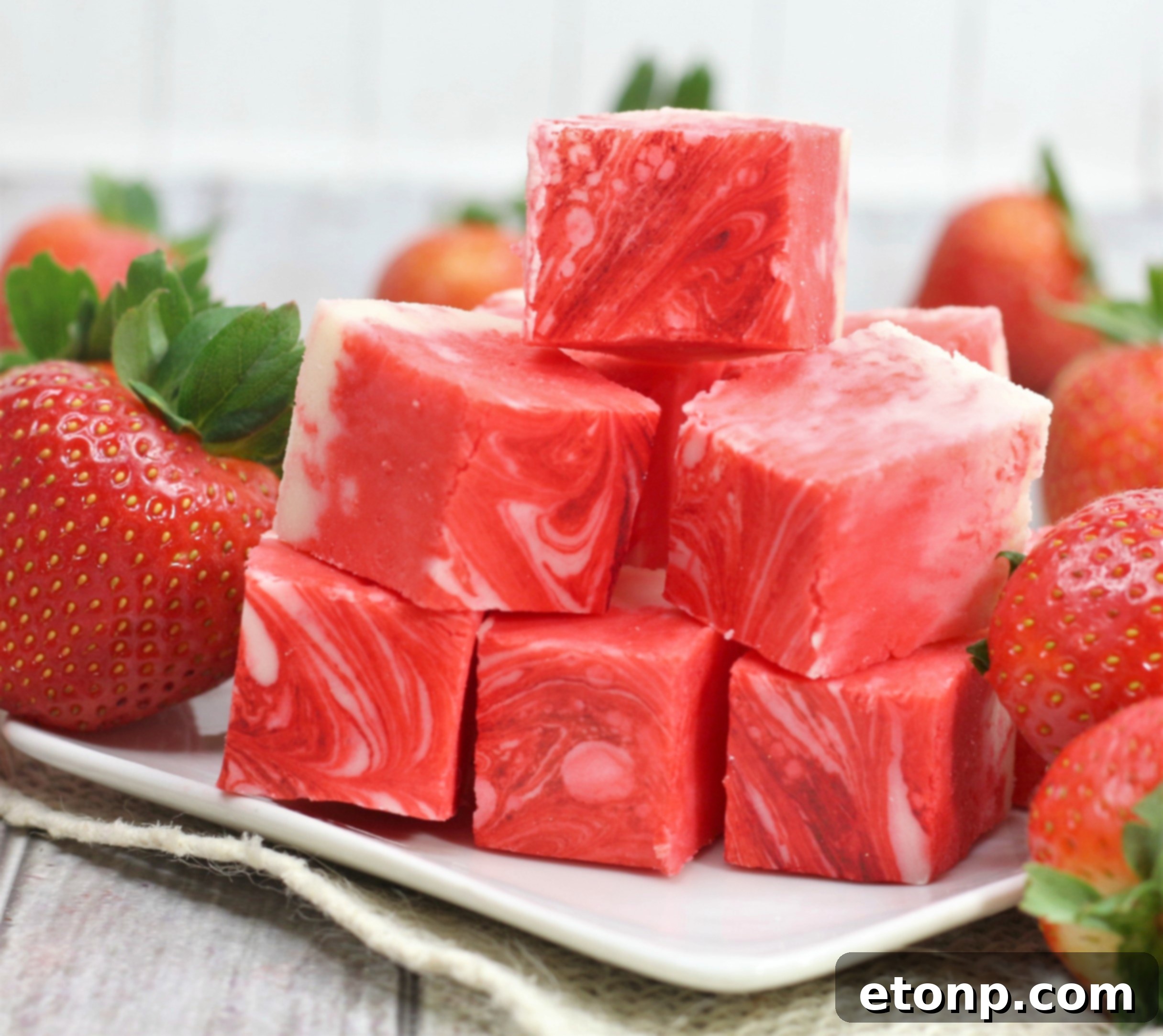 Another perspective of the strawberry swirl fudge, highlighting its pink and white pattern