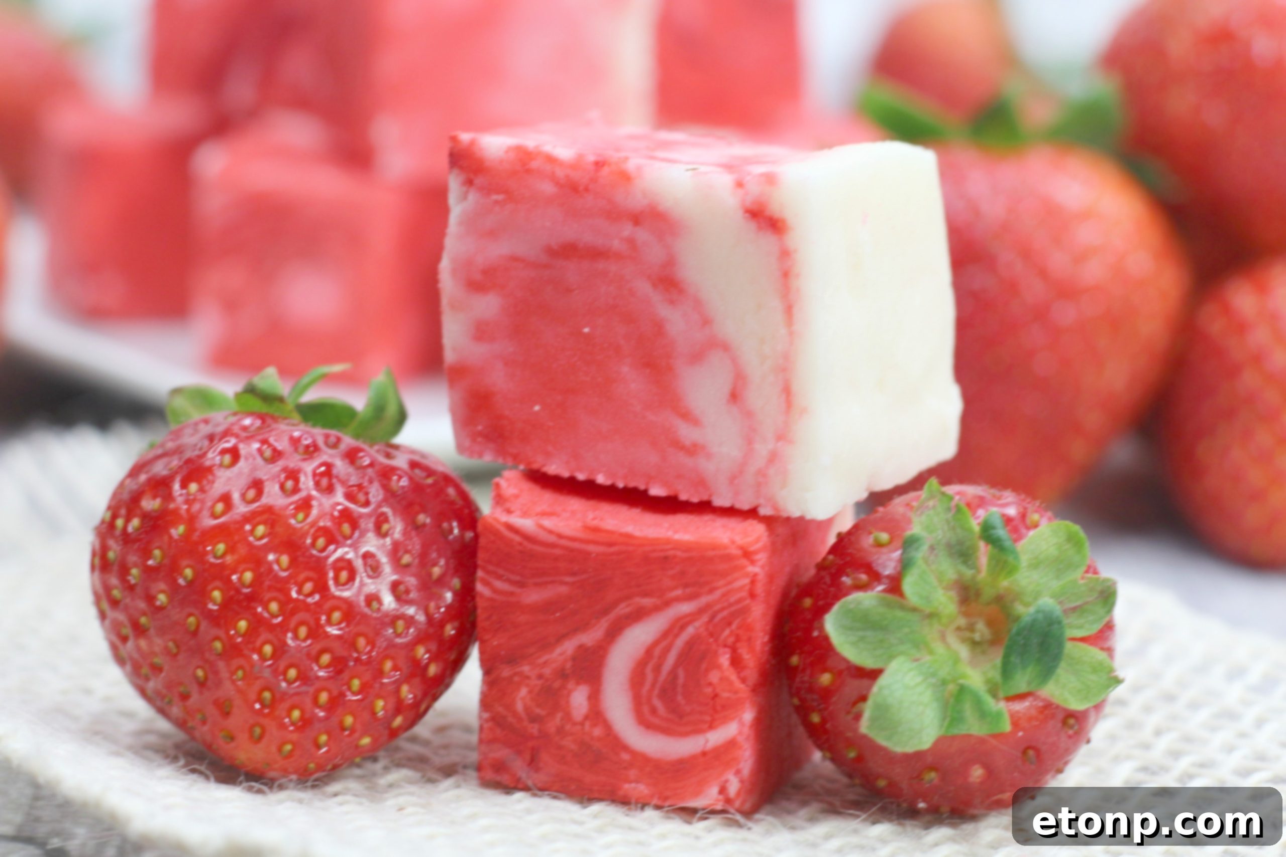 A wider shot of the platter of strawberry swirl fudge, ready for serving