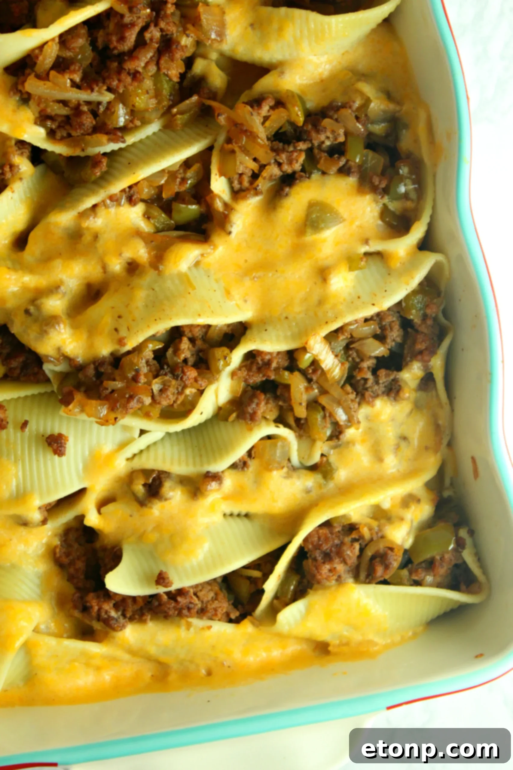 Overhead view of a baking dish filled with Philly Cheese Steak Stuffed Shells, ready for the oven.
