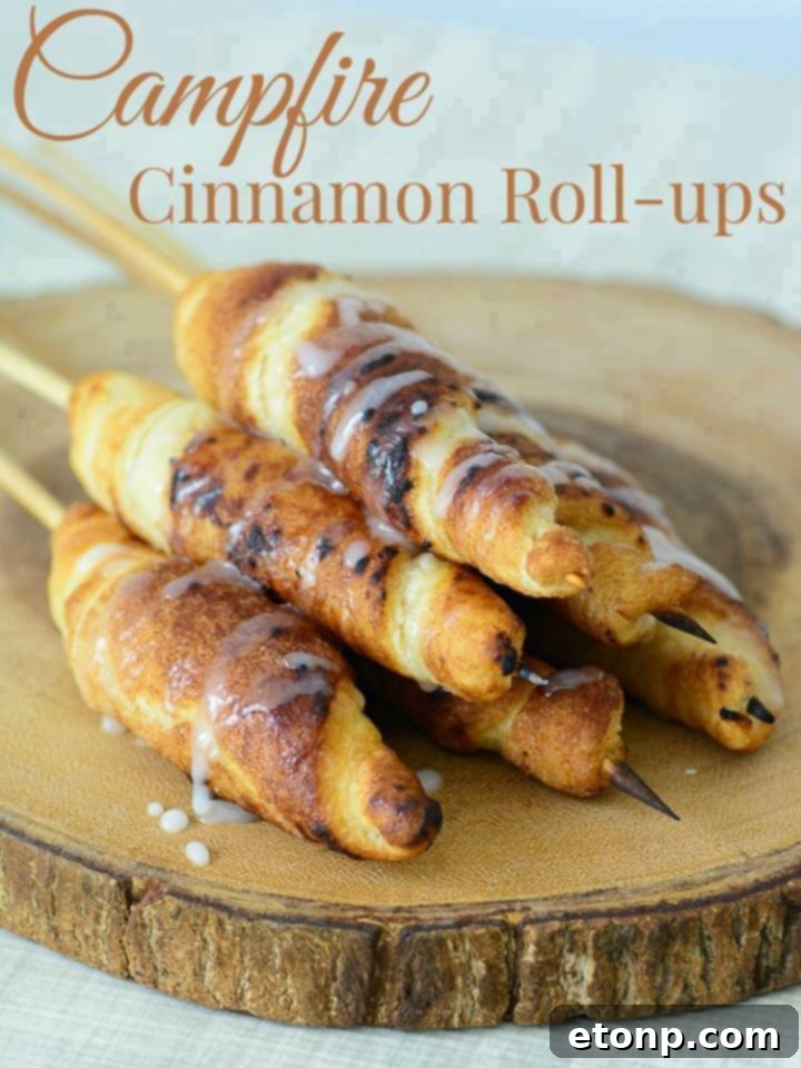 Campfire Cinnamon Roll-Ups being cooked over an open fire