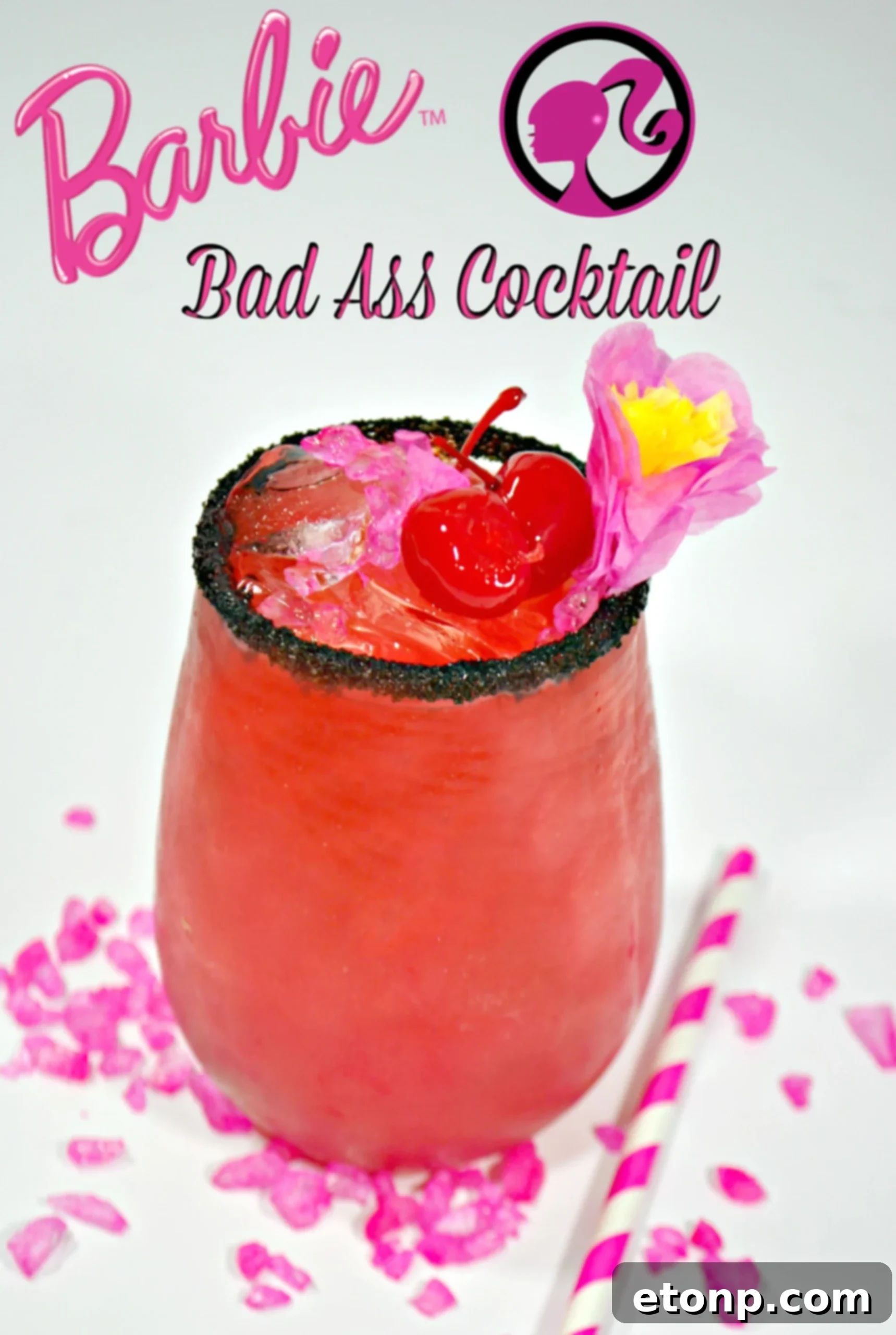 An overhead shot of the Barbie cocktail, emphasizing its bright color and elegant garnish.