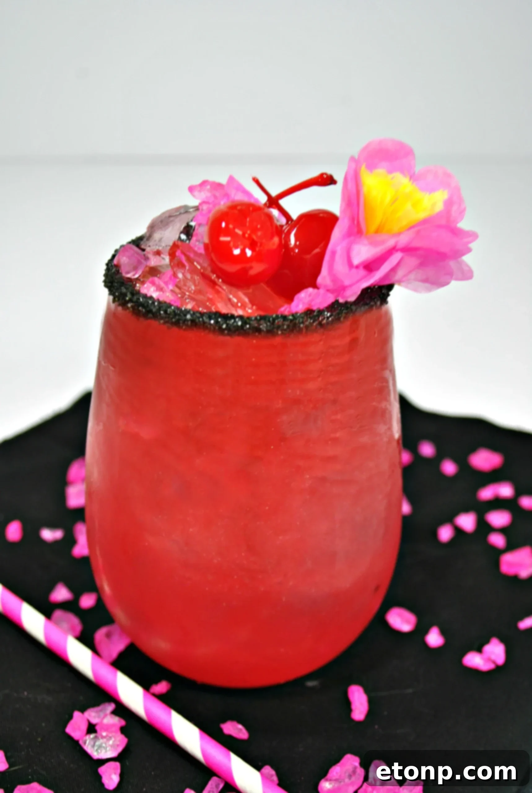 Another perspective of the Barbie cocktail, emphasizing its overall bright and inviting appearance.