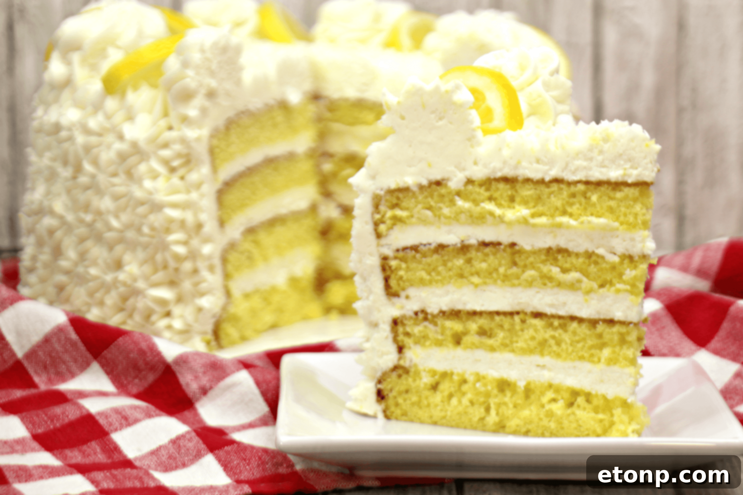 A close-up view of the intricate layers of a beautifully frosted cake, showcasing the detail in the crumb and frosting.