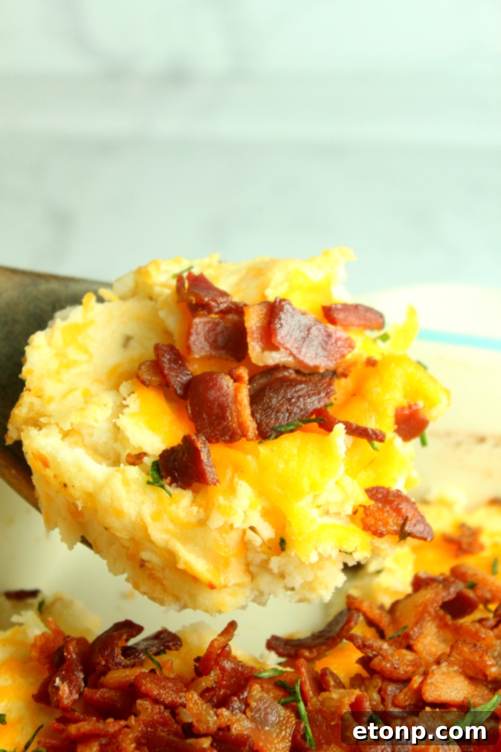 Ultimate Loaded Mashed Potato Casserole 9 Various shredded cheeses displayed, hinting at customization options for the casserole.