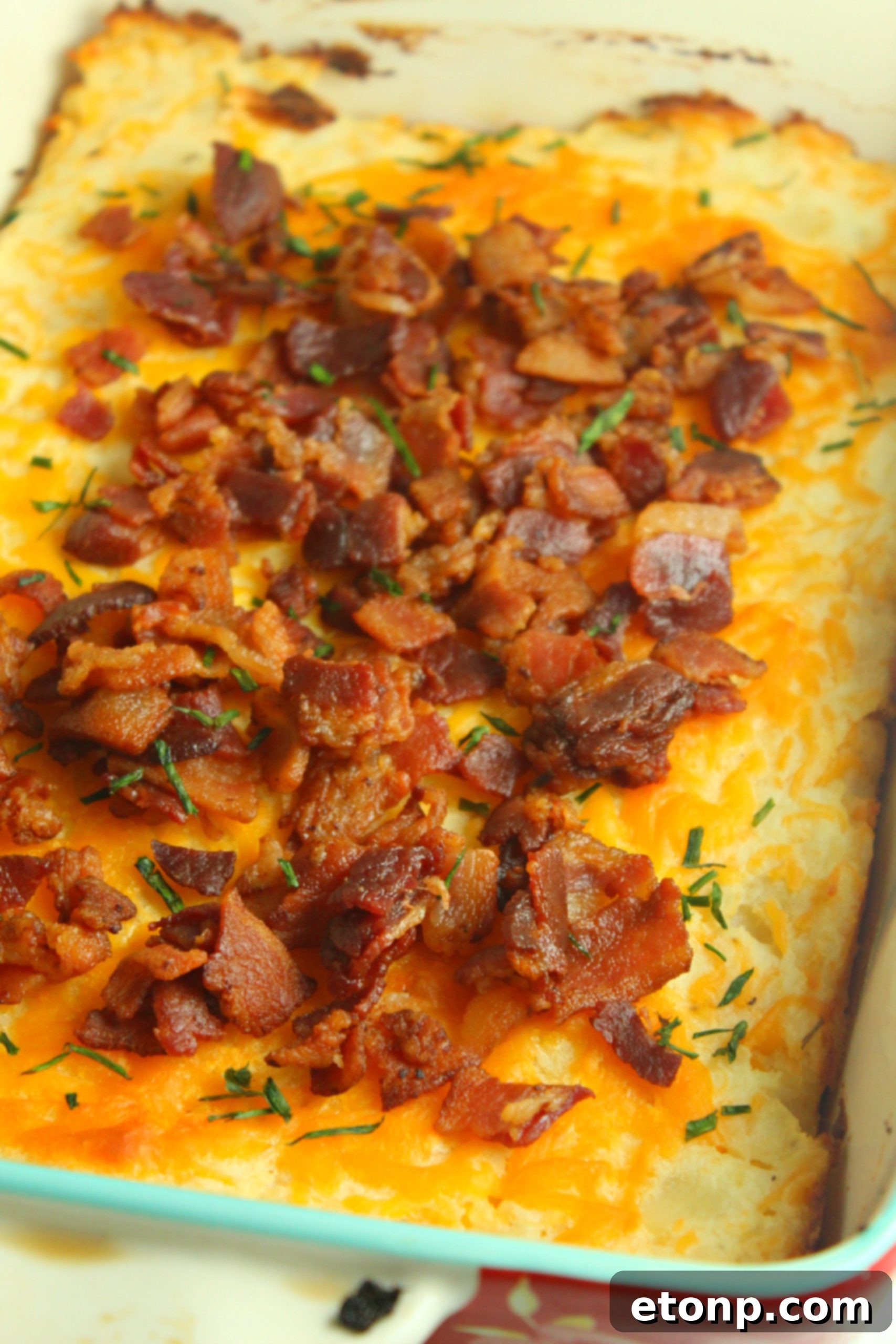 Ultimate Loaded Mashed Potato Casserole 10 A dish of creamy sour cream, representing the rich base of the casserole.