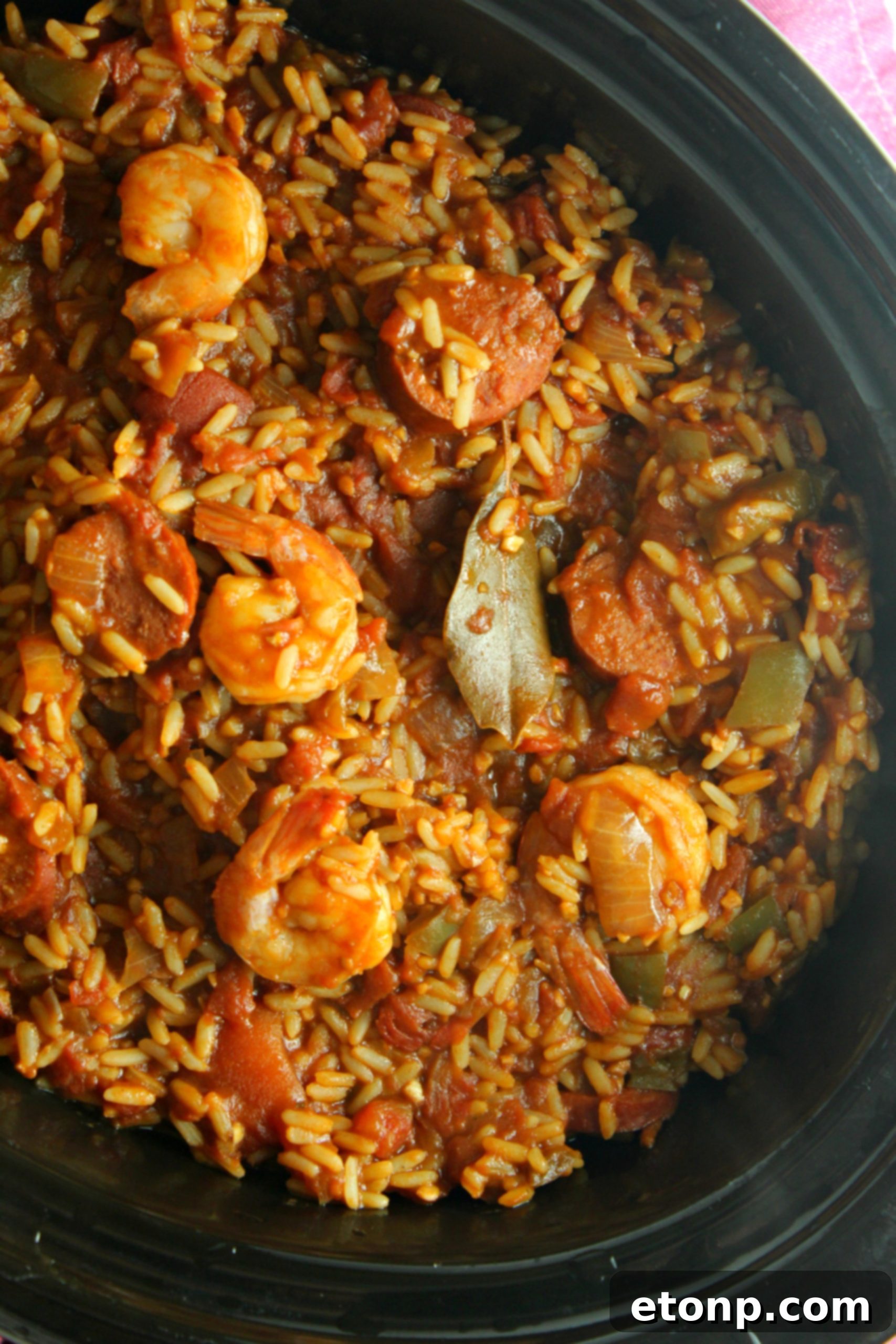 A close-up of a serving of Slow Cooker Jambalaya, highlighting the perfectly cooked rice and juicy ingredients