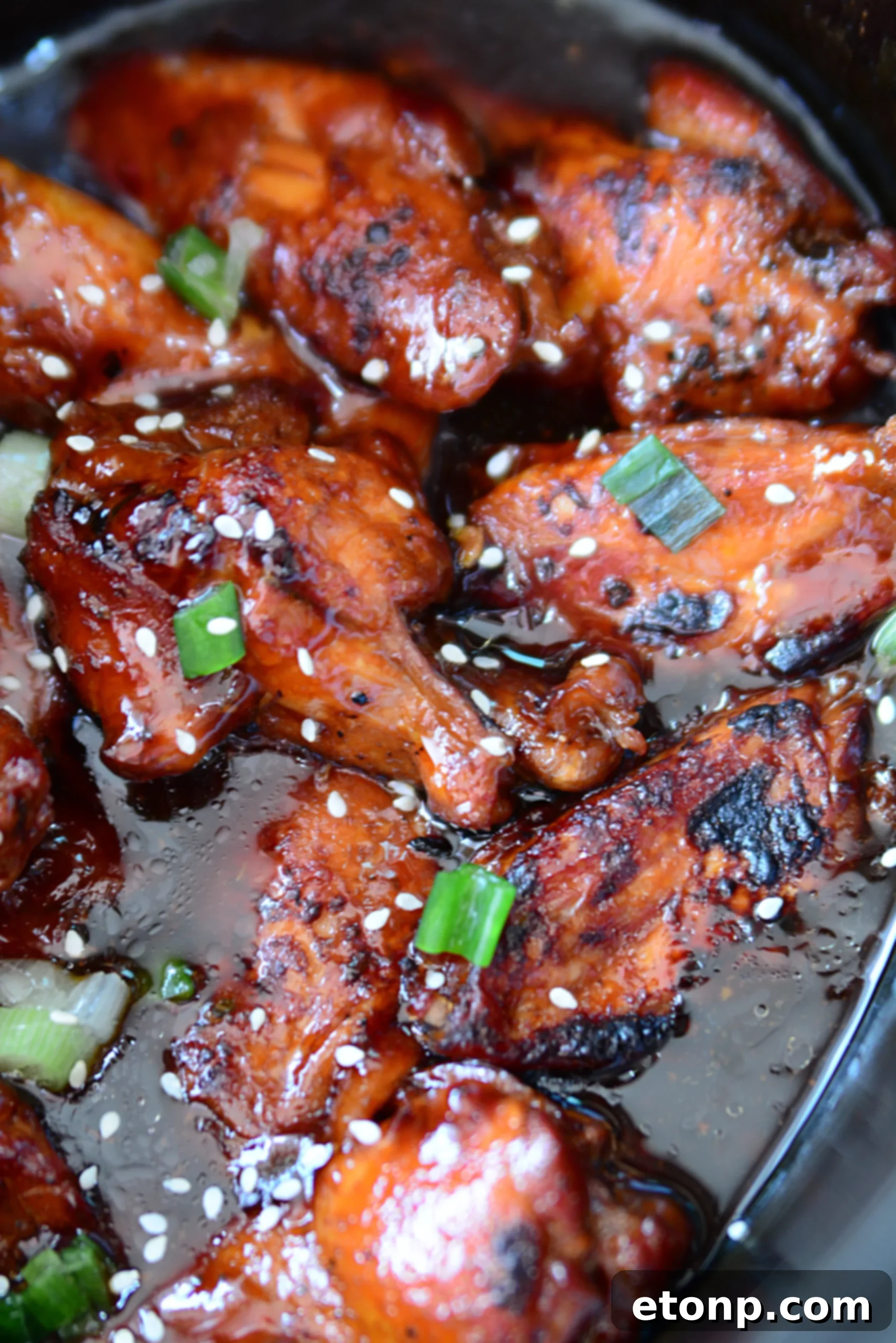 Close-up of glazed teriyaki chicken wings, a perfect appetizer