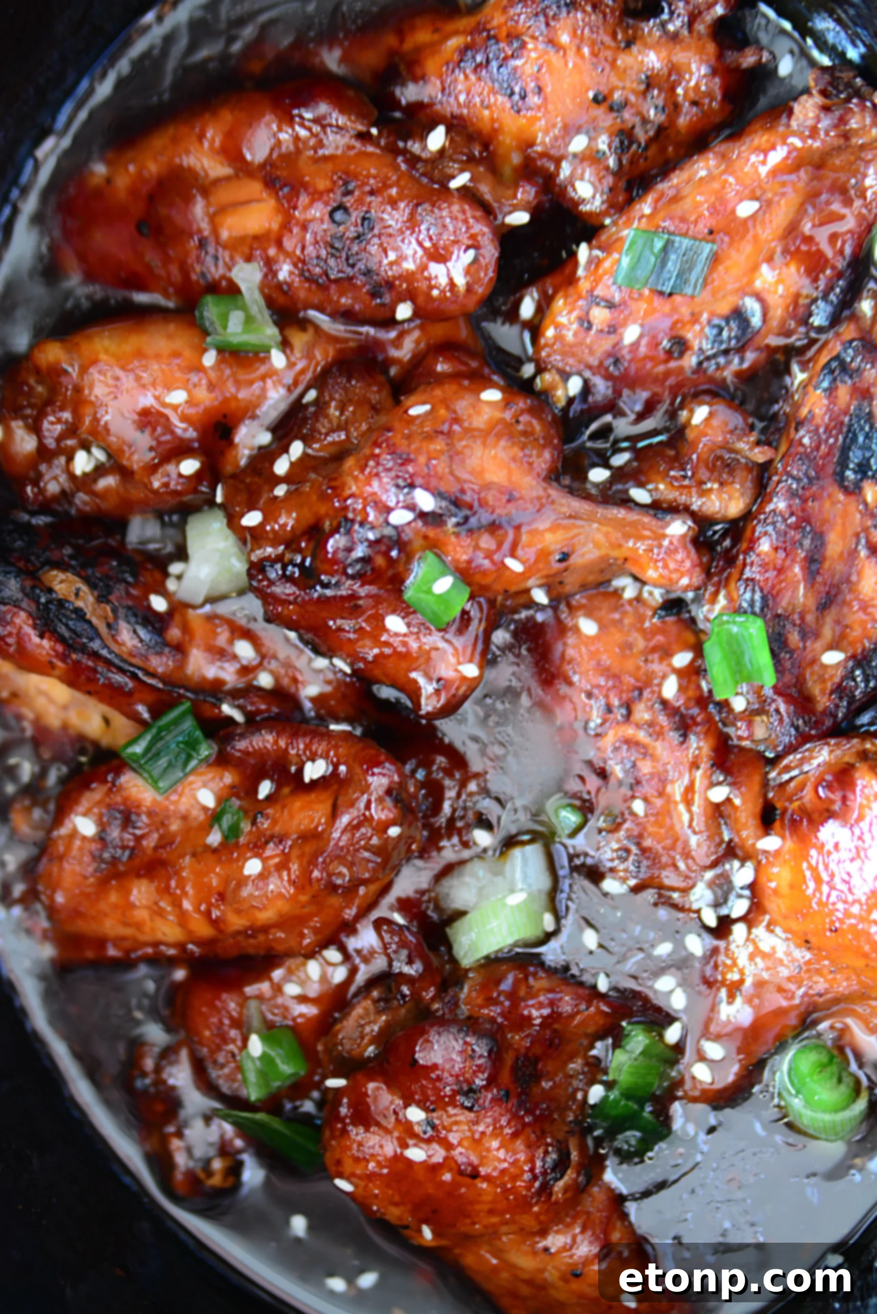 Family and friends enjoying a platter of slow cooker teriyaki wings, with no leftovers in sight