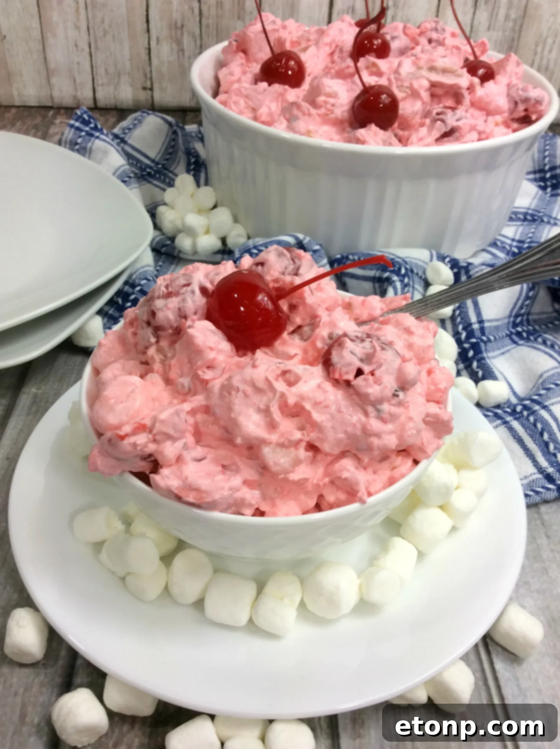 Overhead shot of Cherry Fluff Salad, showing its fluffy texture and vibrant colors.