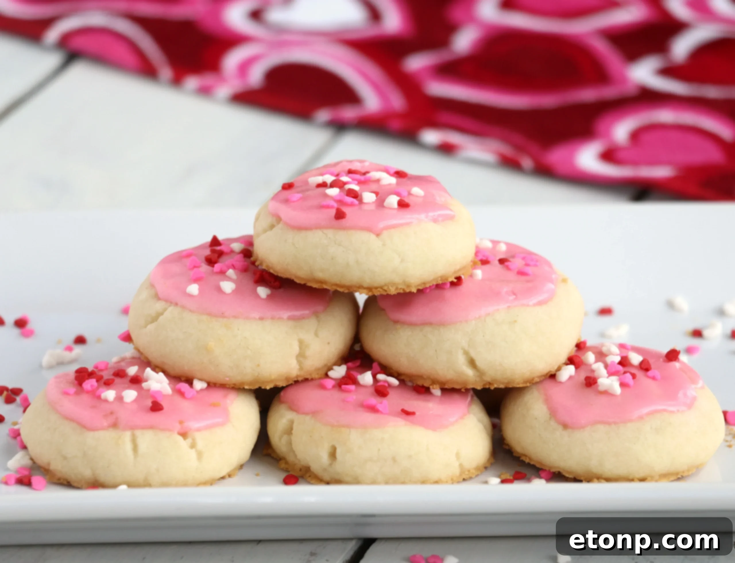 Velvet Vanilla Frosted Delights 8 Melt-Away Vanilla Frosted Cookies carefully placed on a cooling rack after baking, awaiting their frosting.