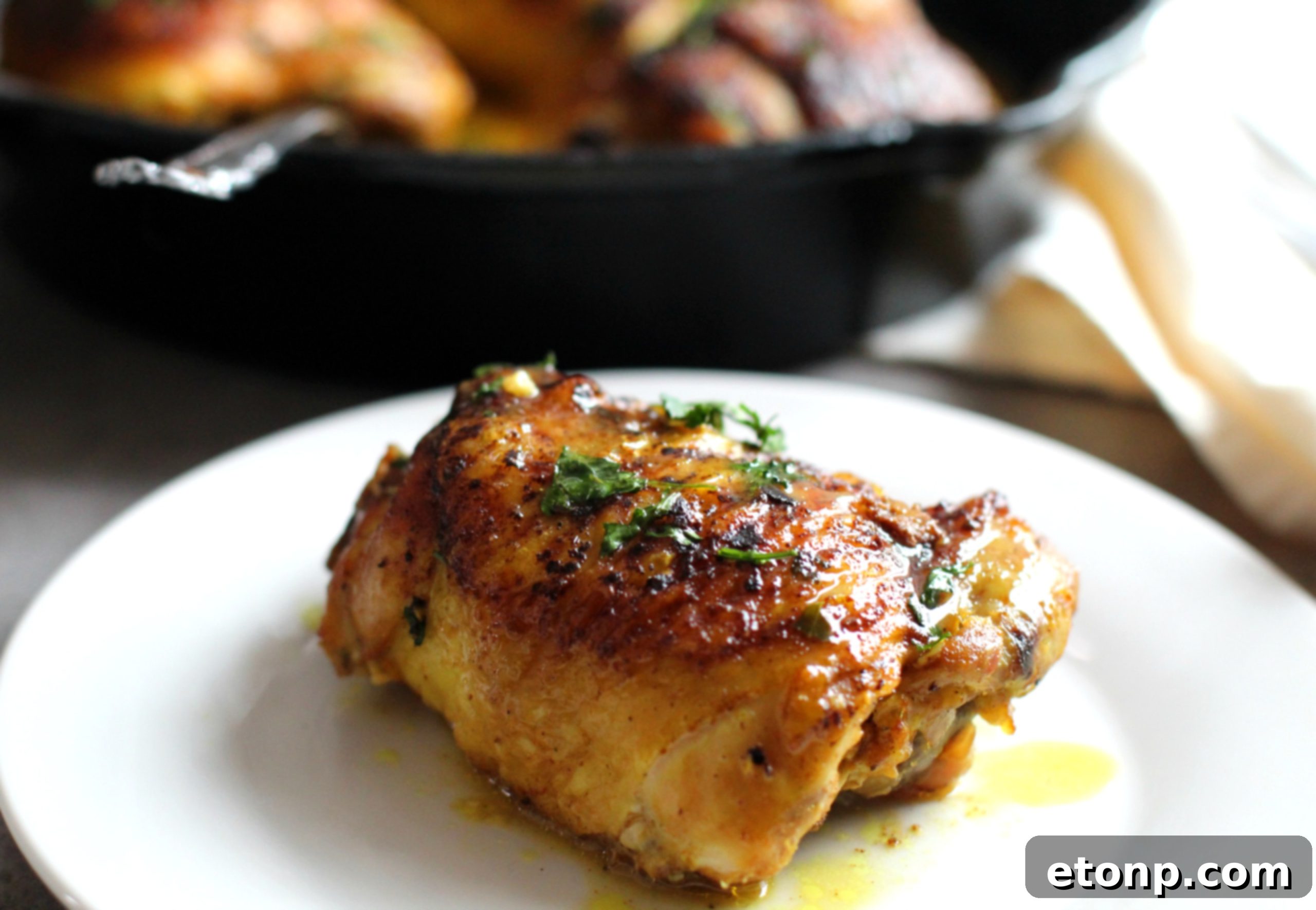 Sticky Sweet Lemon Chicken Skillet 5 Platter of golden brown sugar lemon chicken thighs, ready to be served.