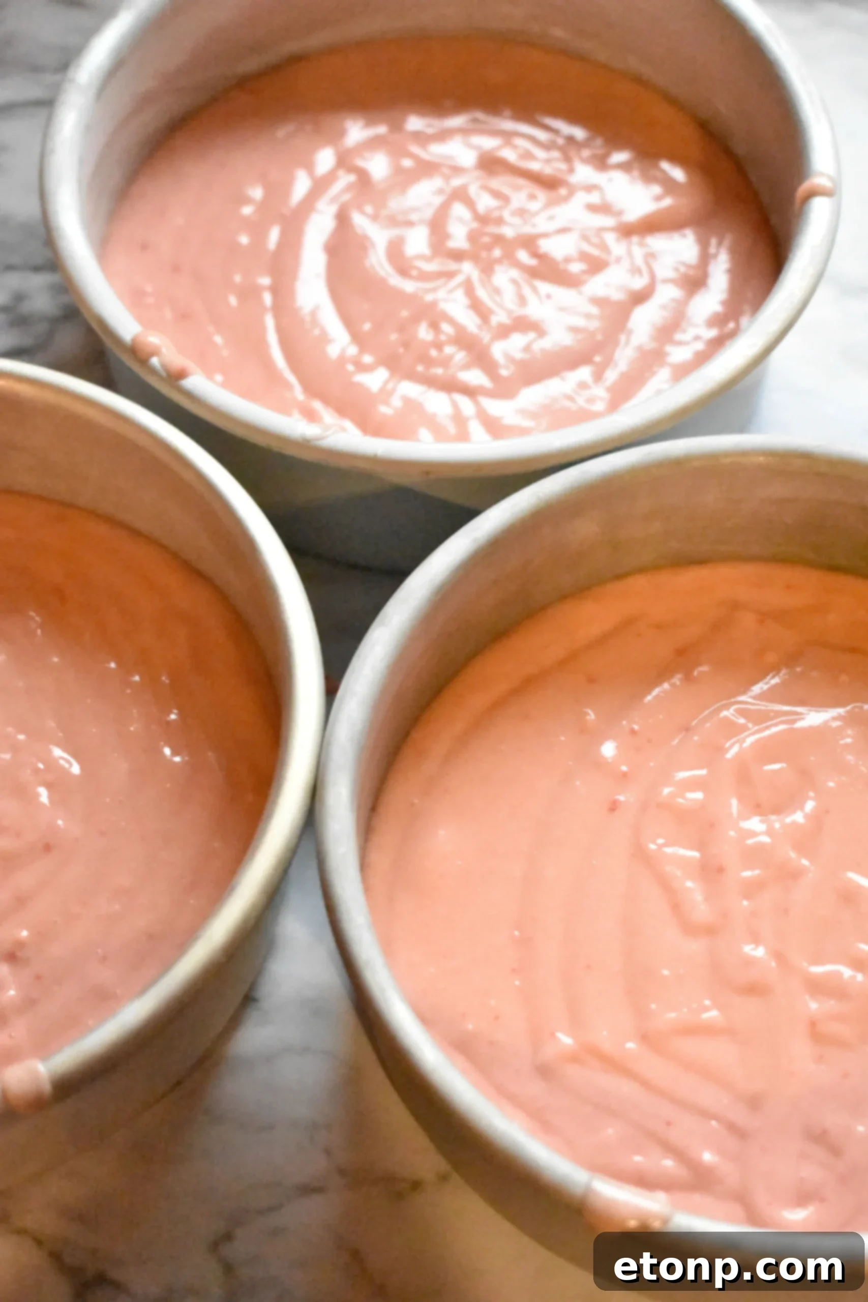 Close-up of the Strawberry Creamsicle Layered Cake, highlighting its perfect three-layer structure and creamy frosting.
