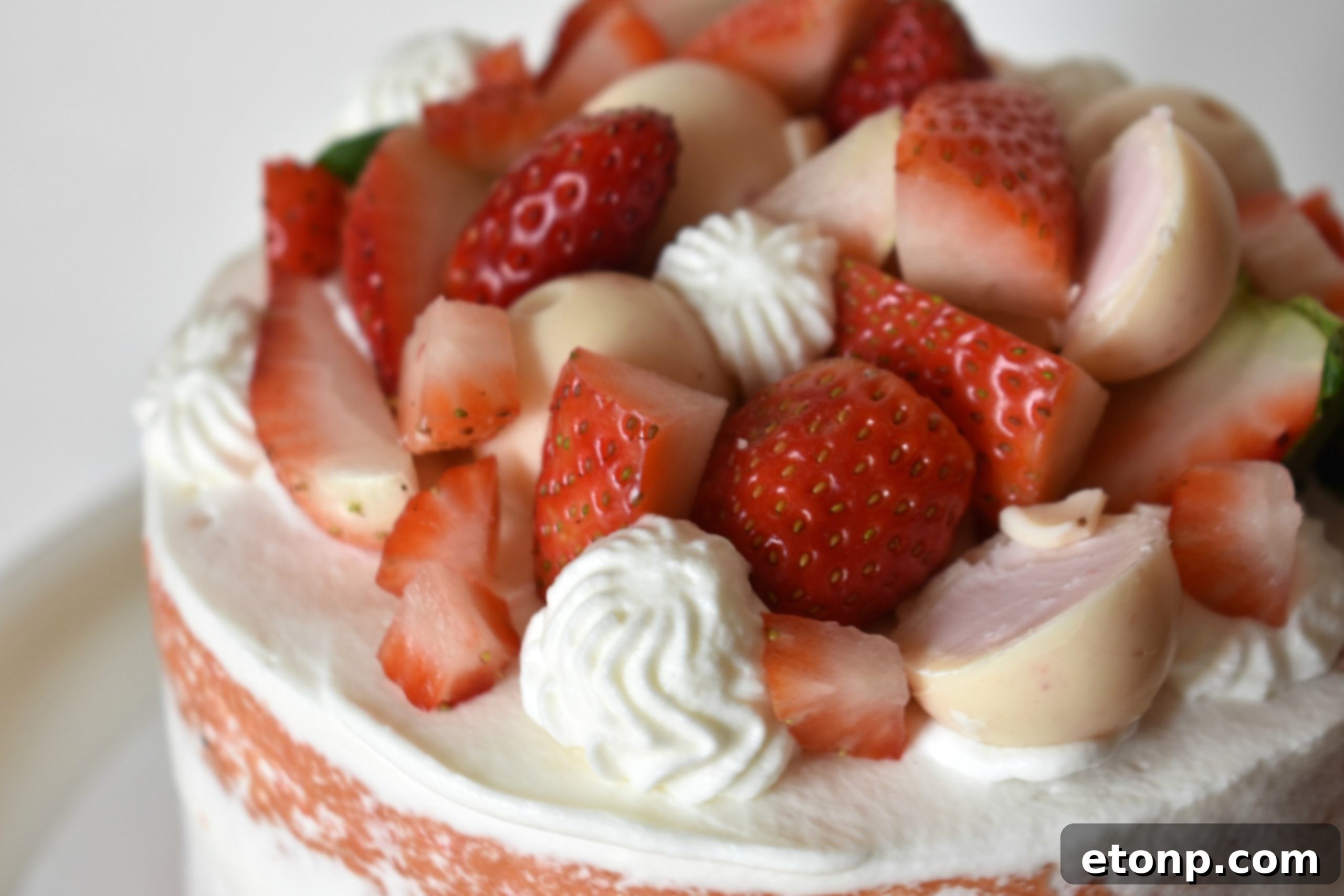 Another appealing shot of the Strawberry Creamsicle Layered Cake, showcasing its inviting layers.