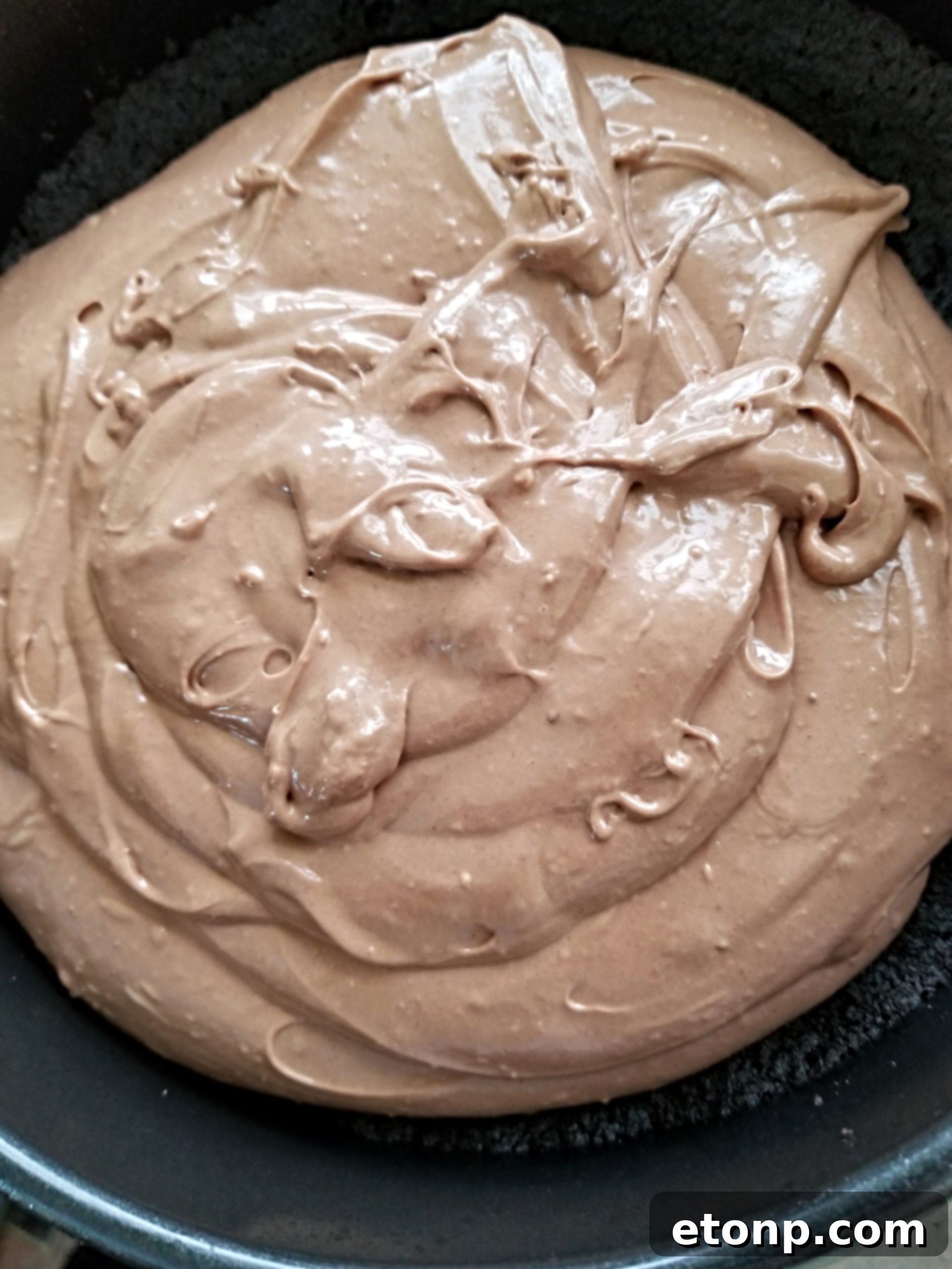 A top-down view of the whole Bailey's Chocolate Cheesecake, ready to be sliced.