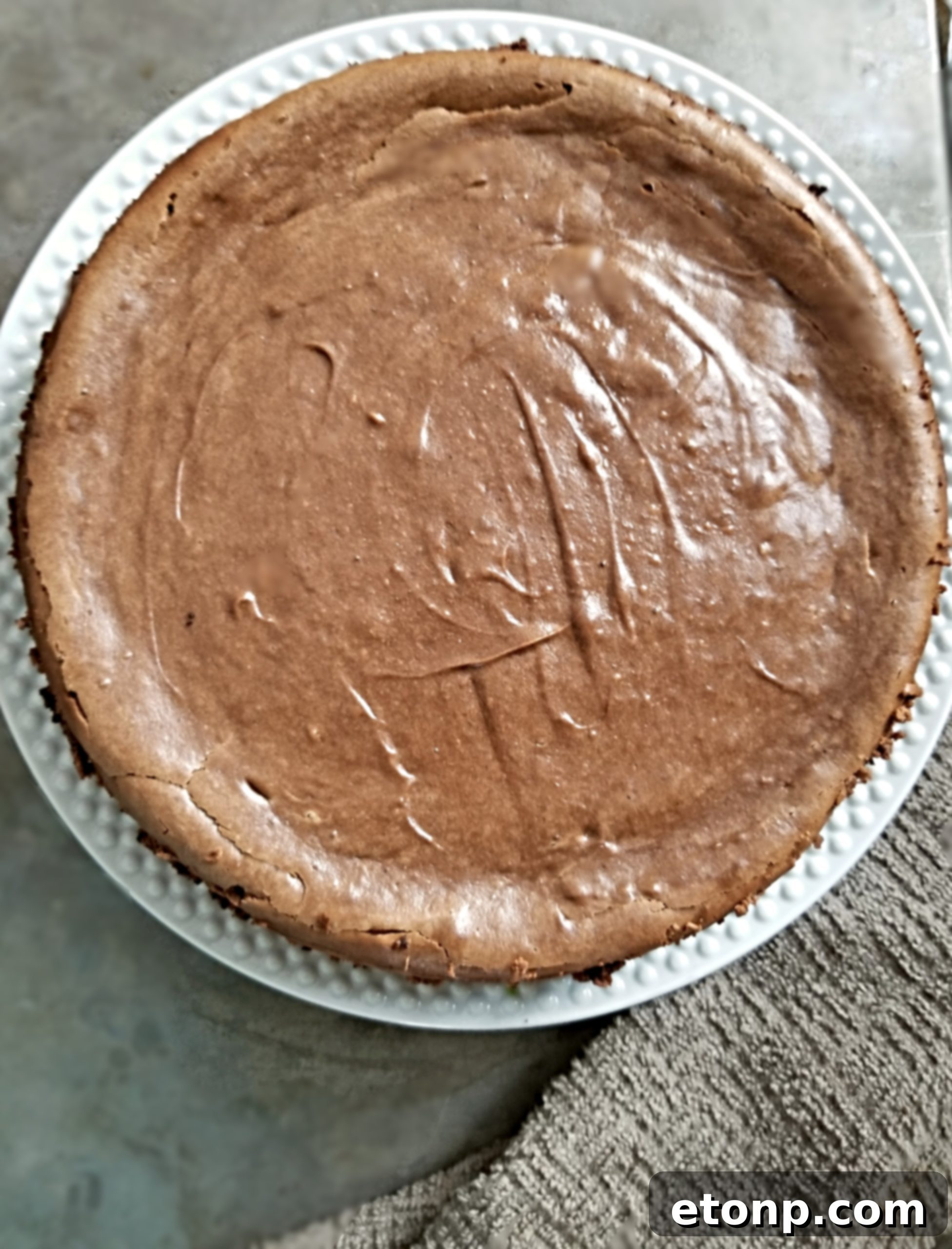 Another inviting close-up of the cheesecake, emphasizing its creamy texture.