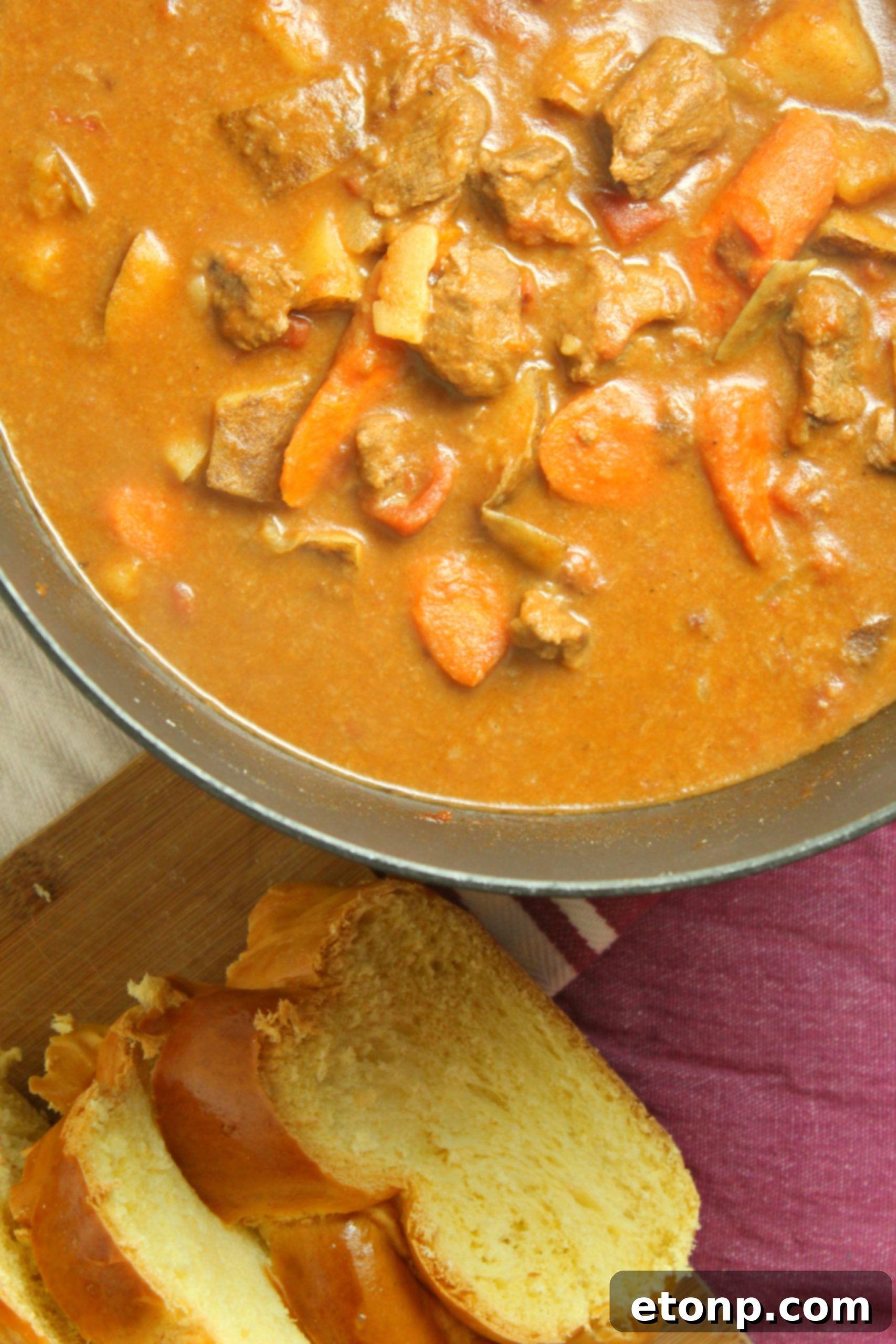 A perfectly portioned bowl of Hungarian Goulash, garnished and ready to be enjoyed, highlighting its comforting appeal.