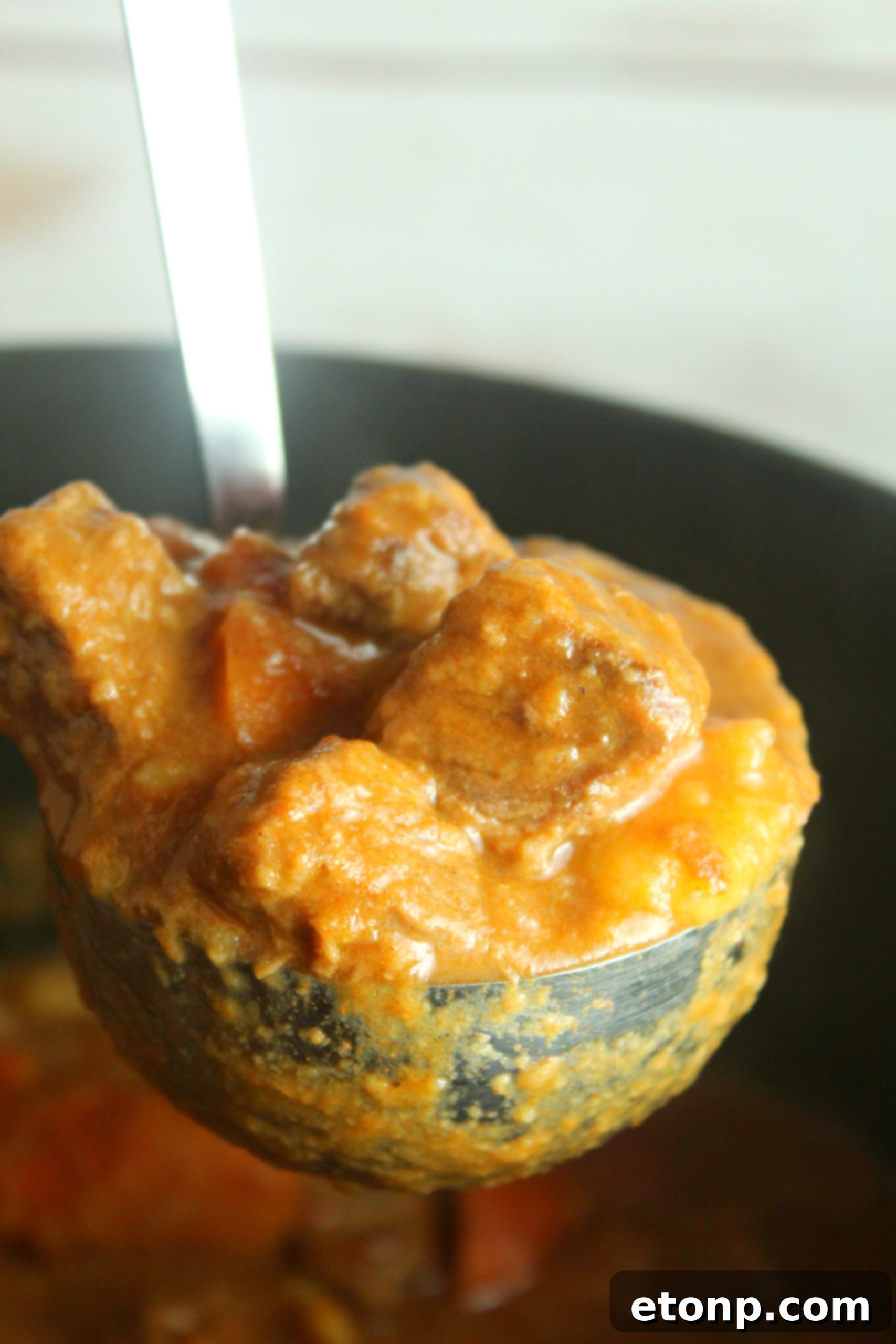 A hearty serving of Hungarian Goulash, steaming gently, perfect for warming up on a cold winter day.