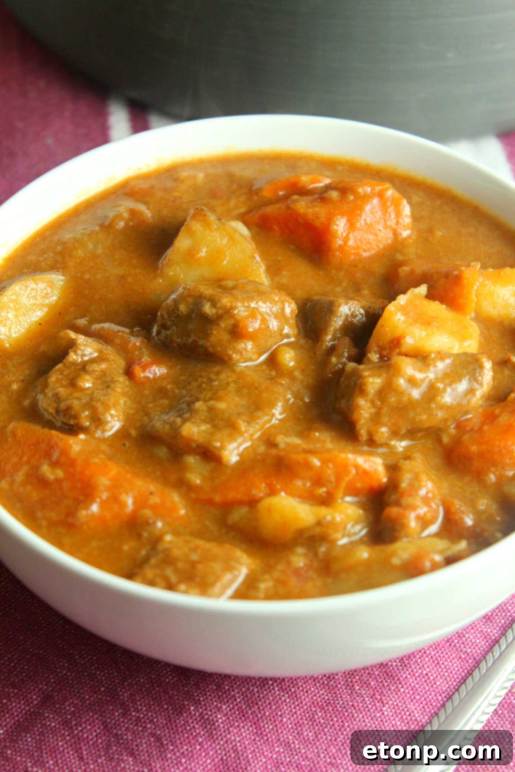 A pot of Hungarian Goulash simmering on the stove, indicating its readiness and delicious aroma filling the kitchen.