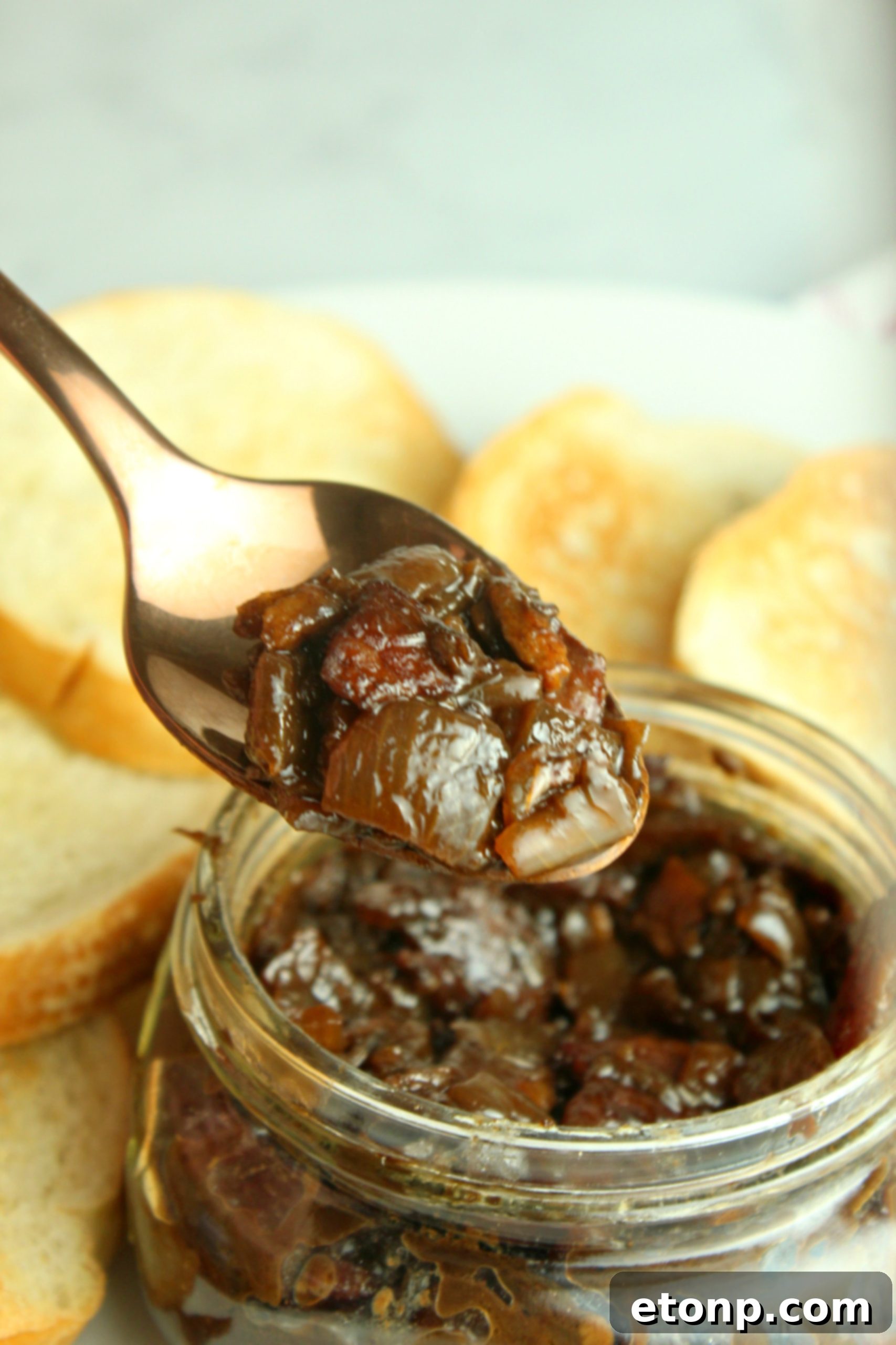Juicy beef burger topped with a generous serving of savory bacon jam and melted cheese