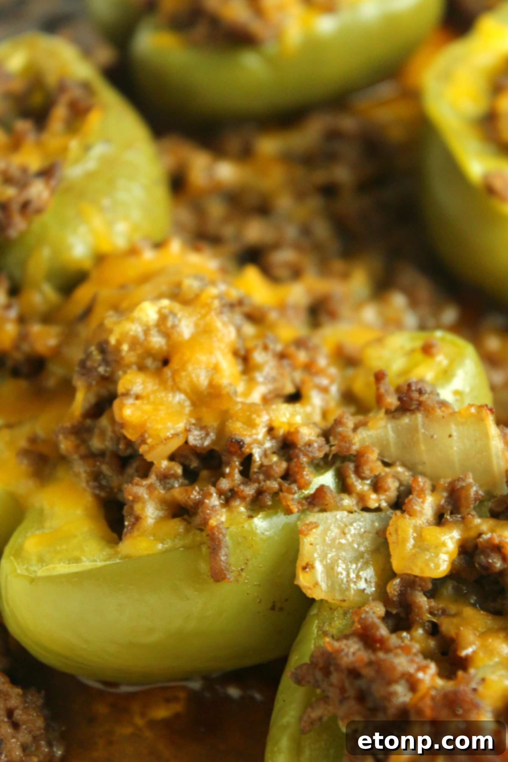 Philly Cheesesteak Pepper Boats 3 Close up of a vibrant red bell pepper, halved and ready for stuffing