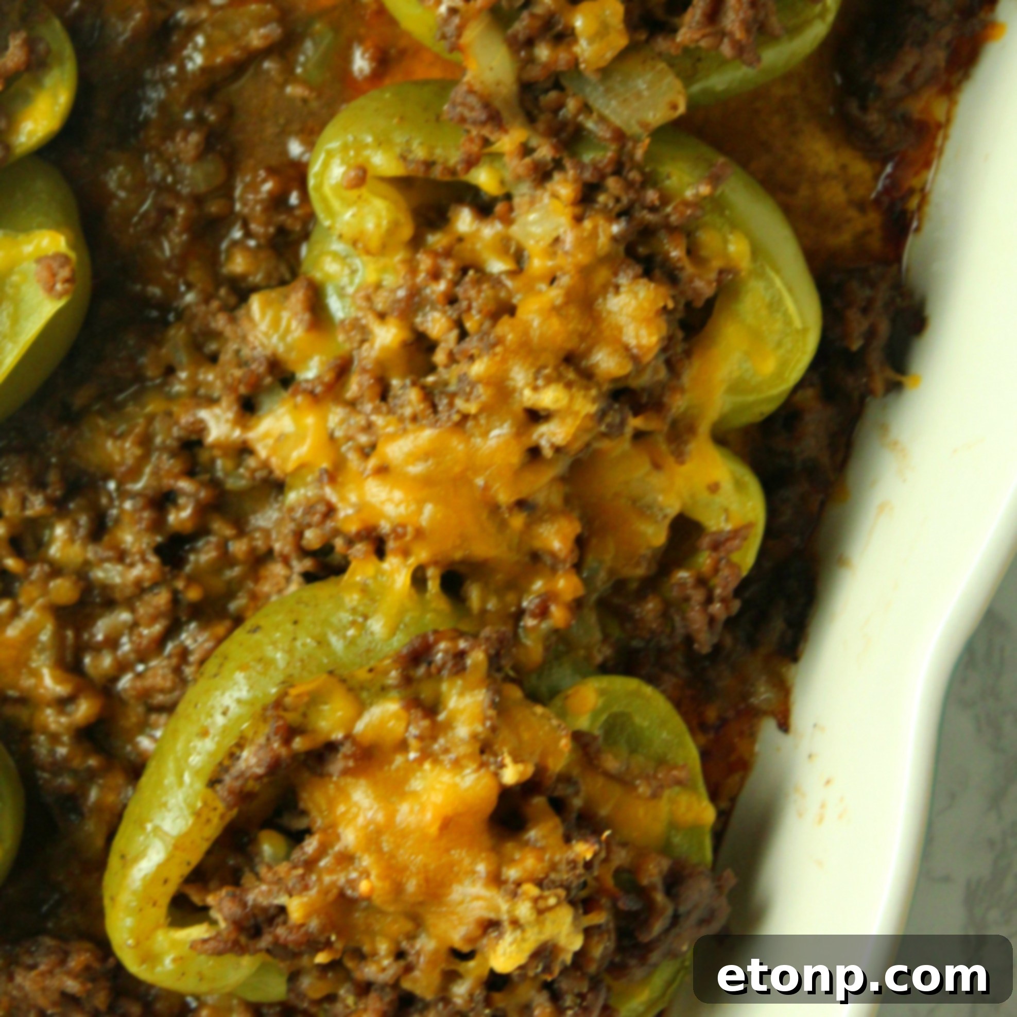 Philly Cheesesteak Pepper Boats 5 A colorful array of bell peppers in red, yellow, and green, suitable for stuffing