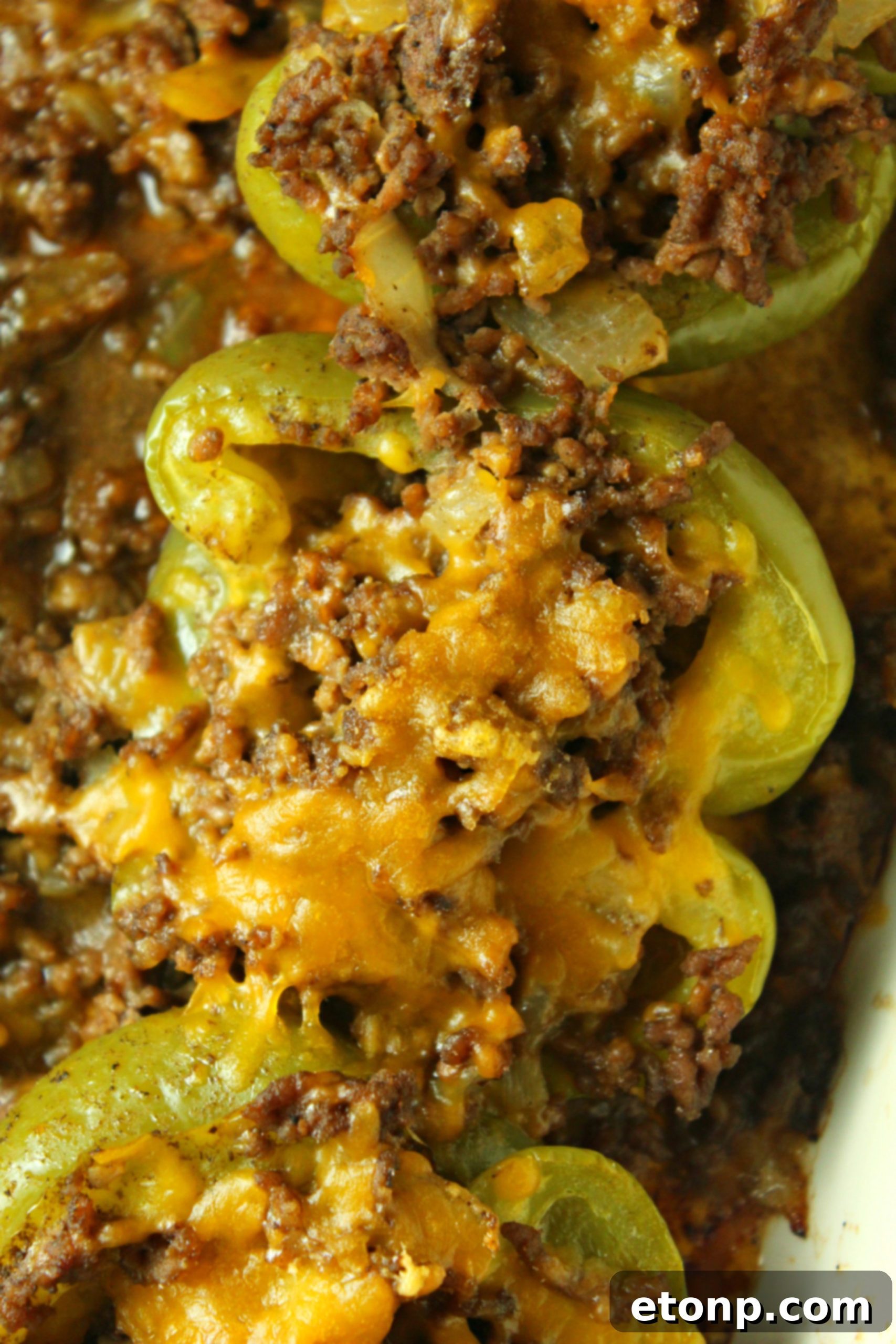 Philly Cheesesteak Pepper Boats 9 A family enjoying dinner together, with a plate of stuffed peppers prominently displayed.