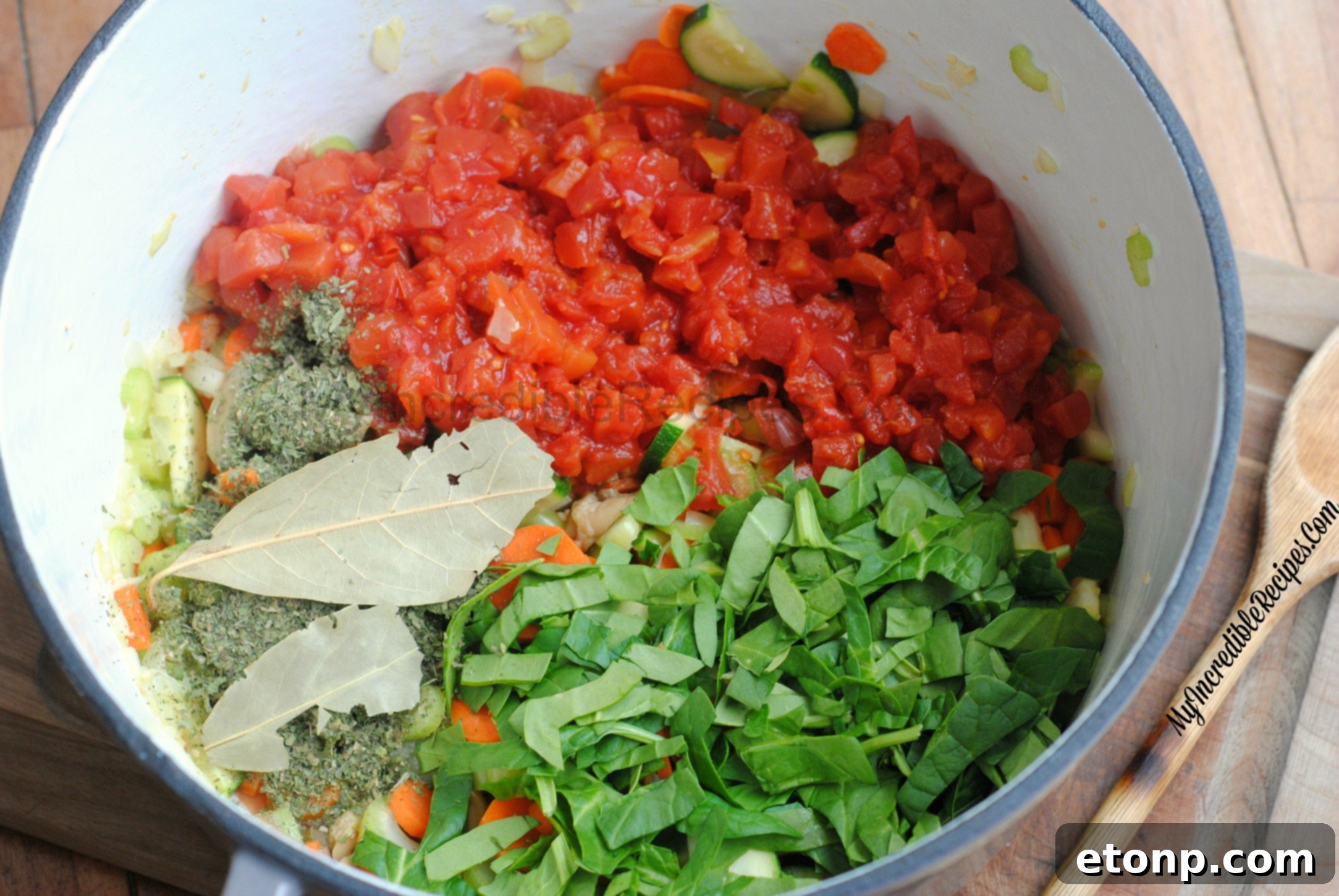 A large pot of hearty chicken and vegetable soup simmering on the stove, steam gently rising.