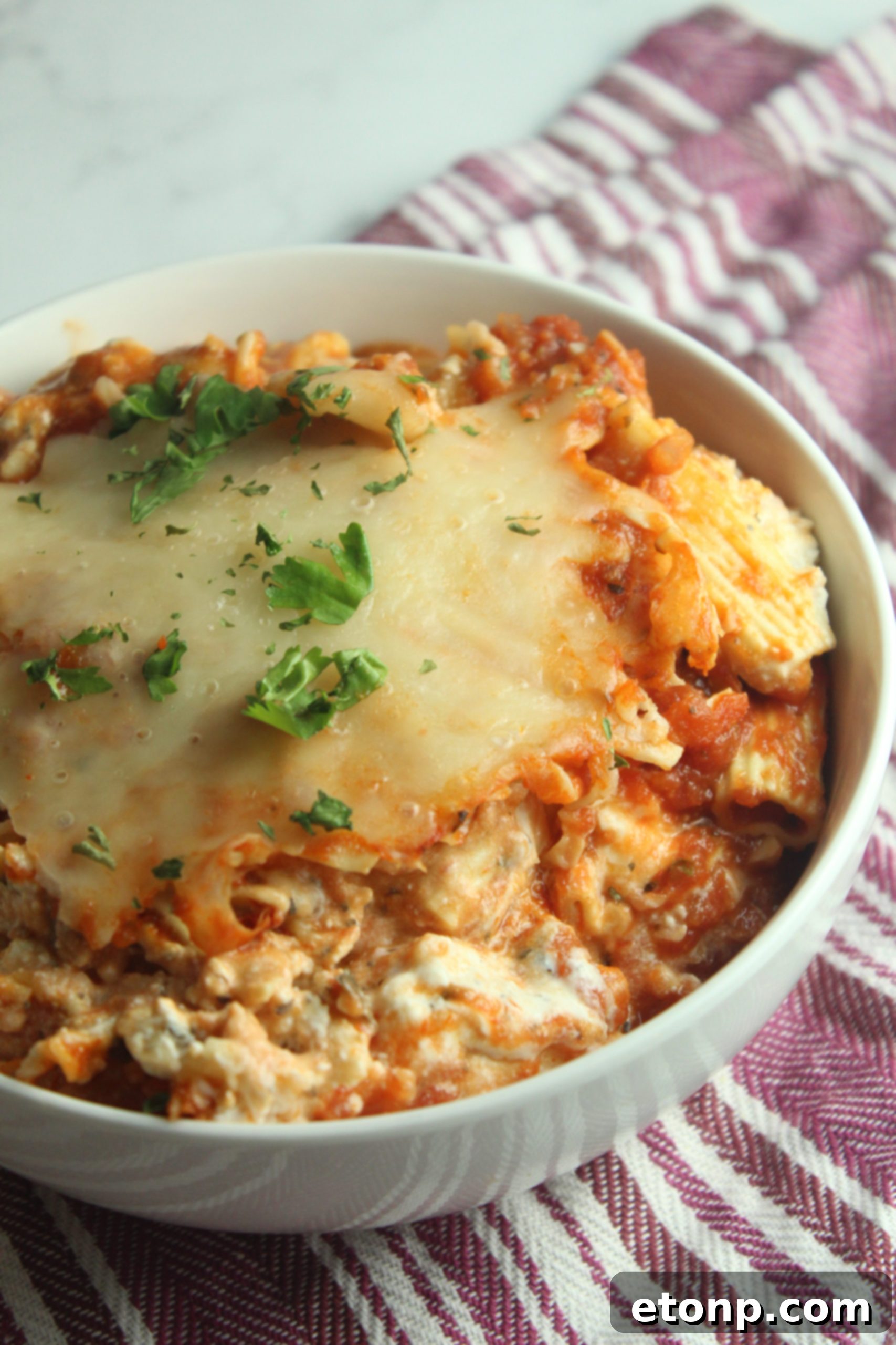 Set It and Forget It Cheesy Baked Ziti 11 A final, enticing shot of the Slow Cooker Cheesy Baked Ziti, showcasing its golden, bubbling cheese and hearty composition.