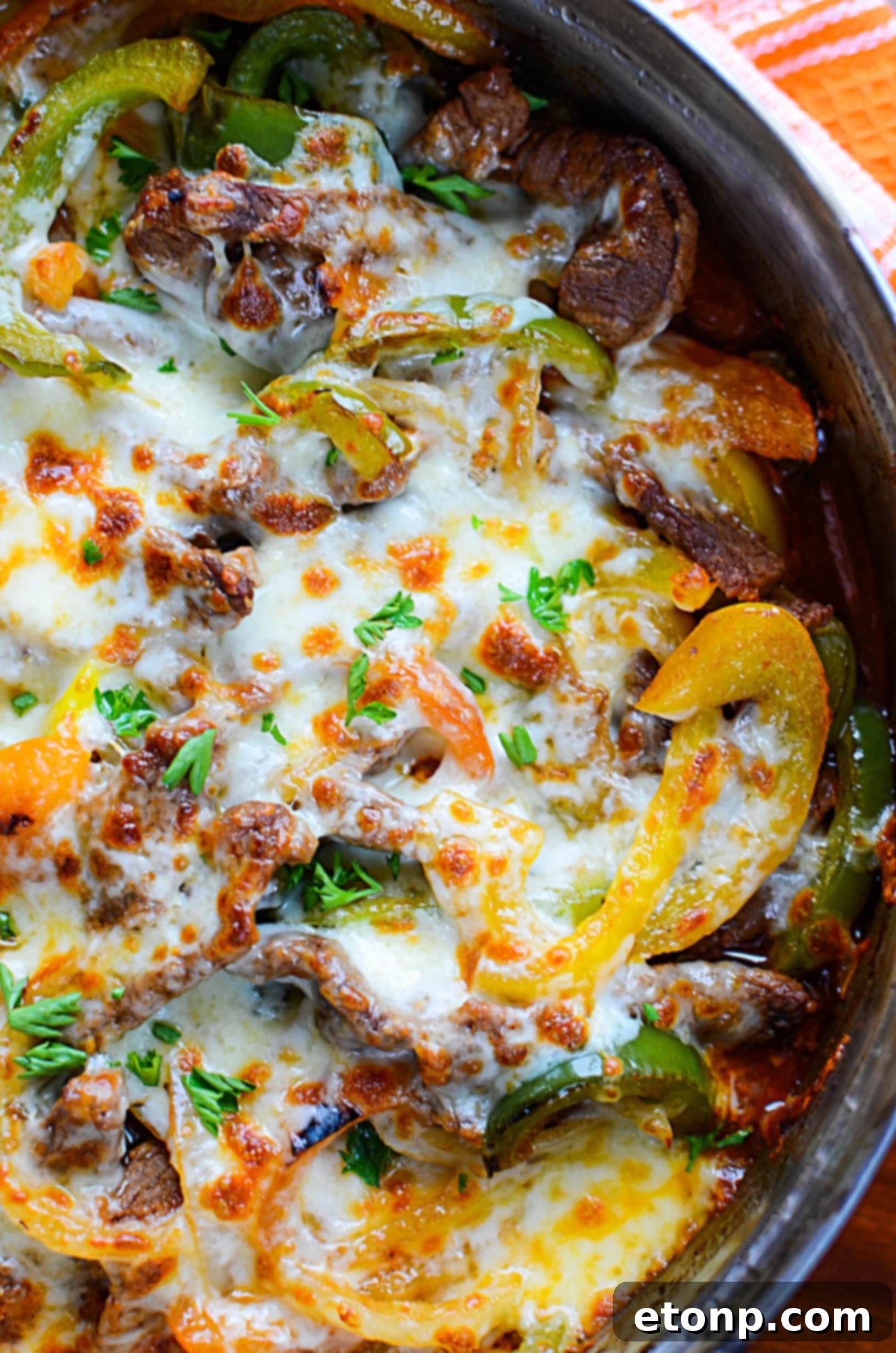 The final delicious shot of the low carb Philly cheesesteak skillet, steam rising, perfectly cooked and ready to eat.