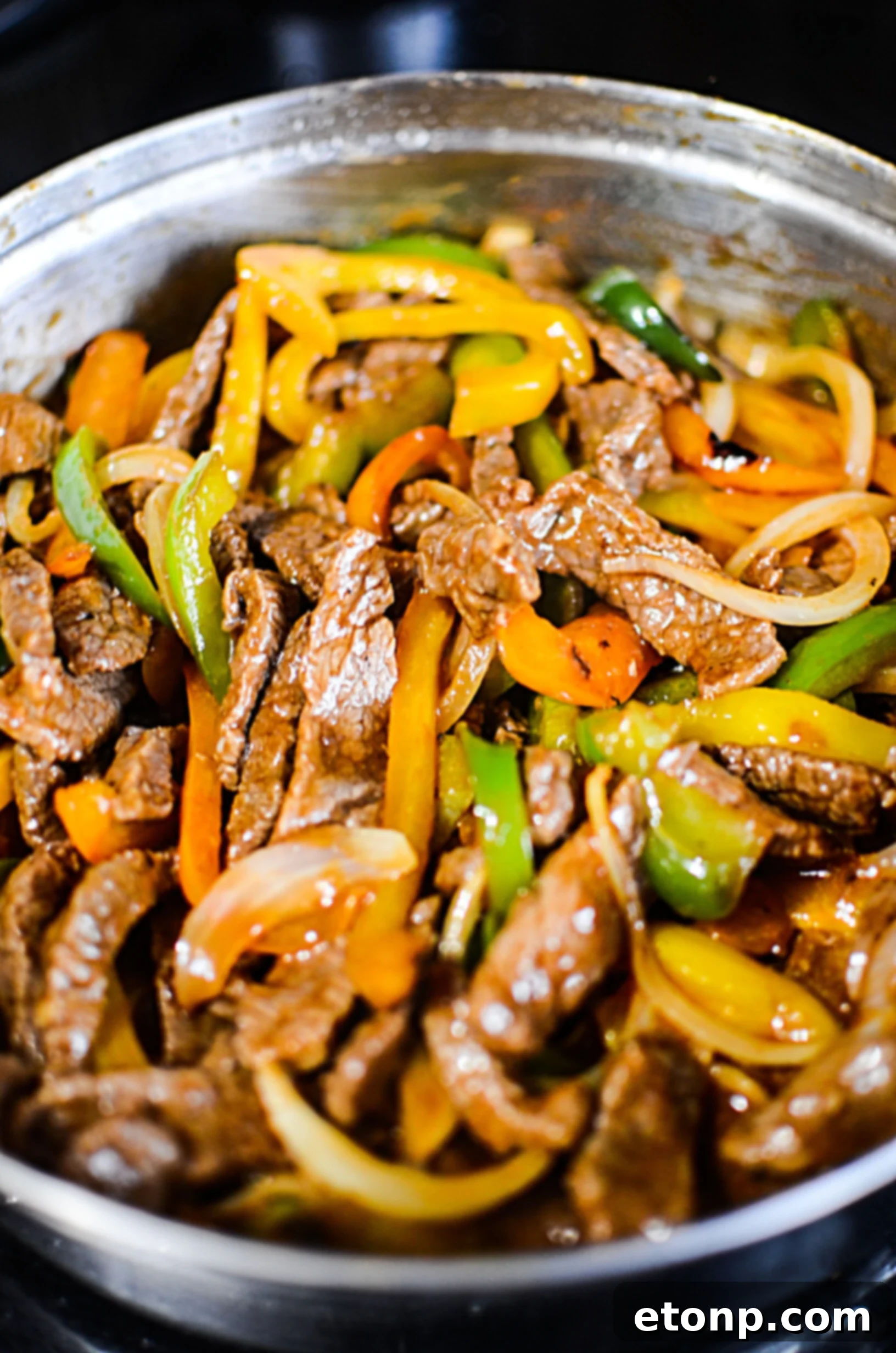 Another view of the low carb Philly cheesesteak skillet, showcasing the vibrant colors of the vegetables and the rich brown of the steak.