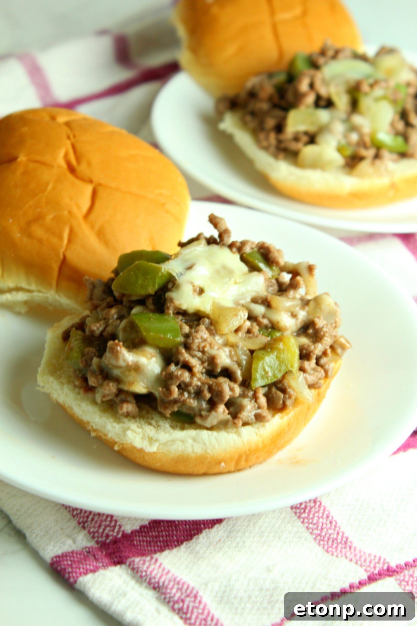 A stack of Cheesesteak Sloppy Joes, emphasizing their hearty and satisfying appearance.