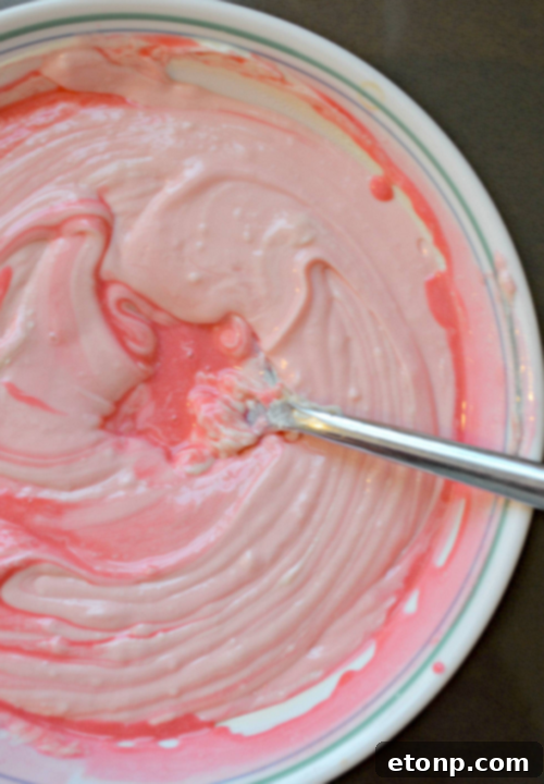 Pink cream cheese fudge cut into charming heart shapes with cookie cutters