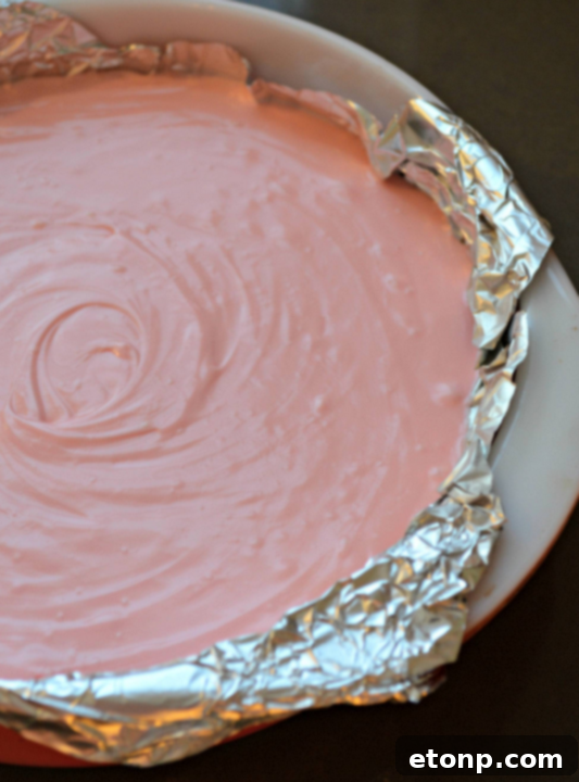 A vibrant platter of pink cream cheese fudge squares, ready to be enjoyed