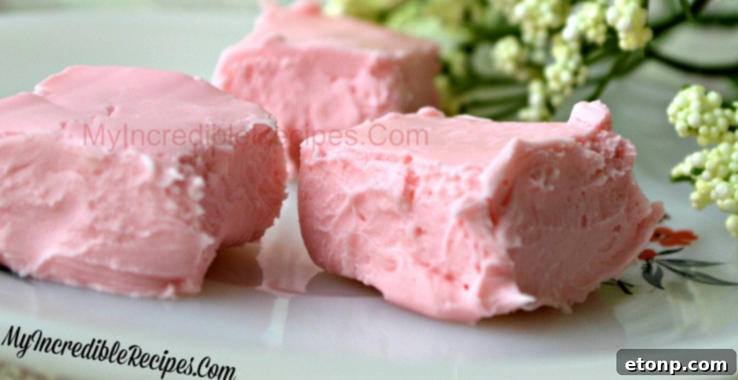 A large batch of cream cheese fudge squares neatly arranged on a tray