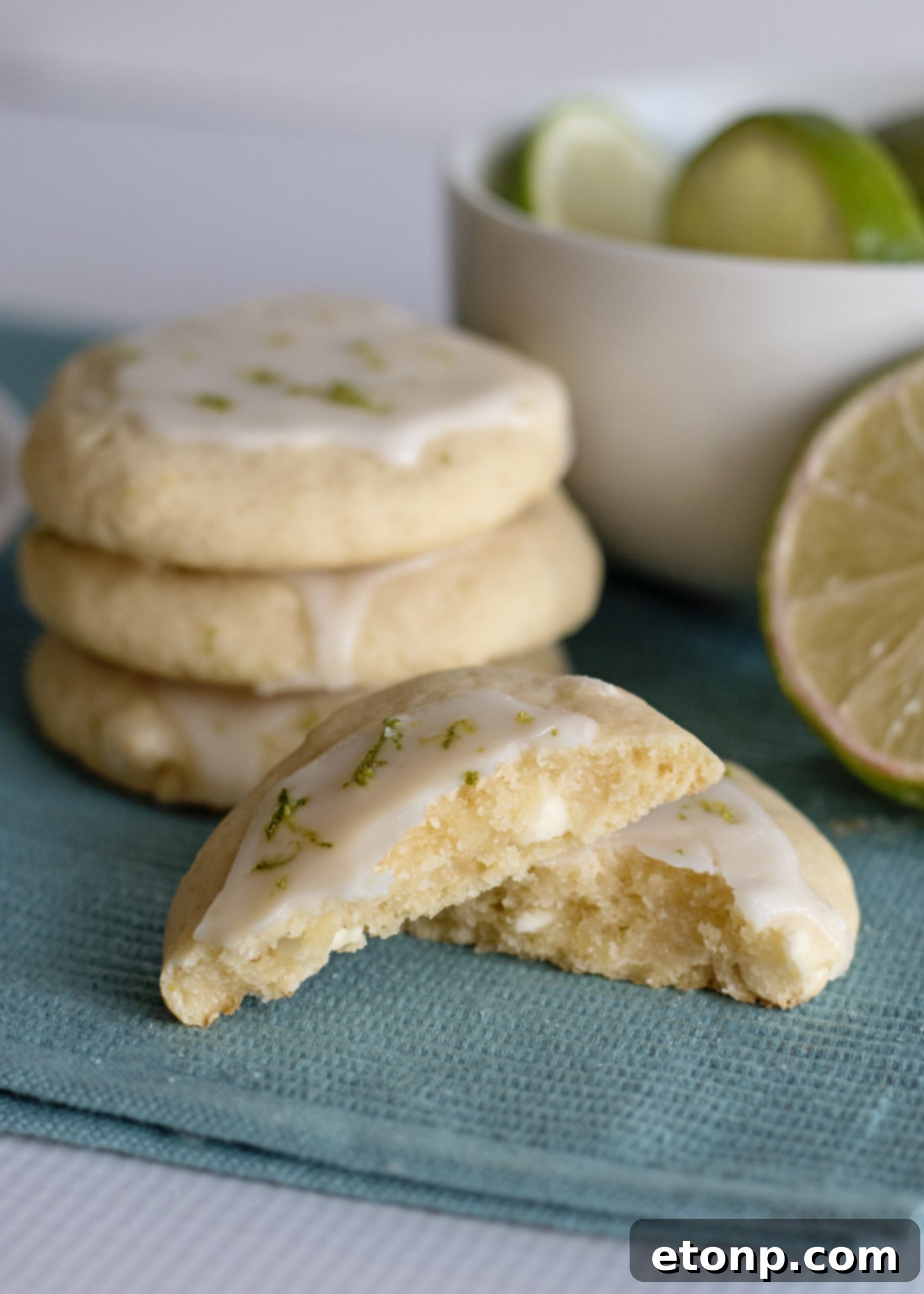 A stack of Key Lime Pie Cookies with a sprig of mint on top