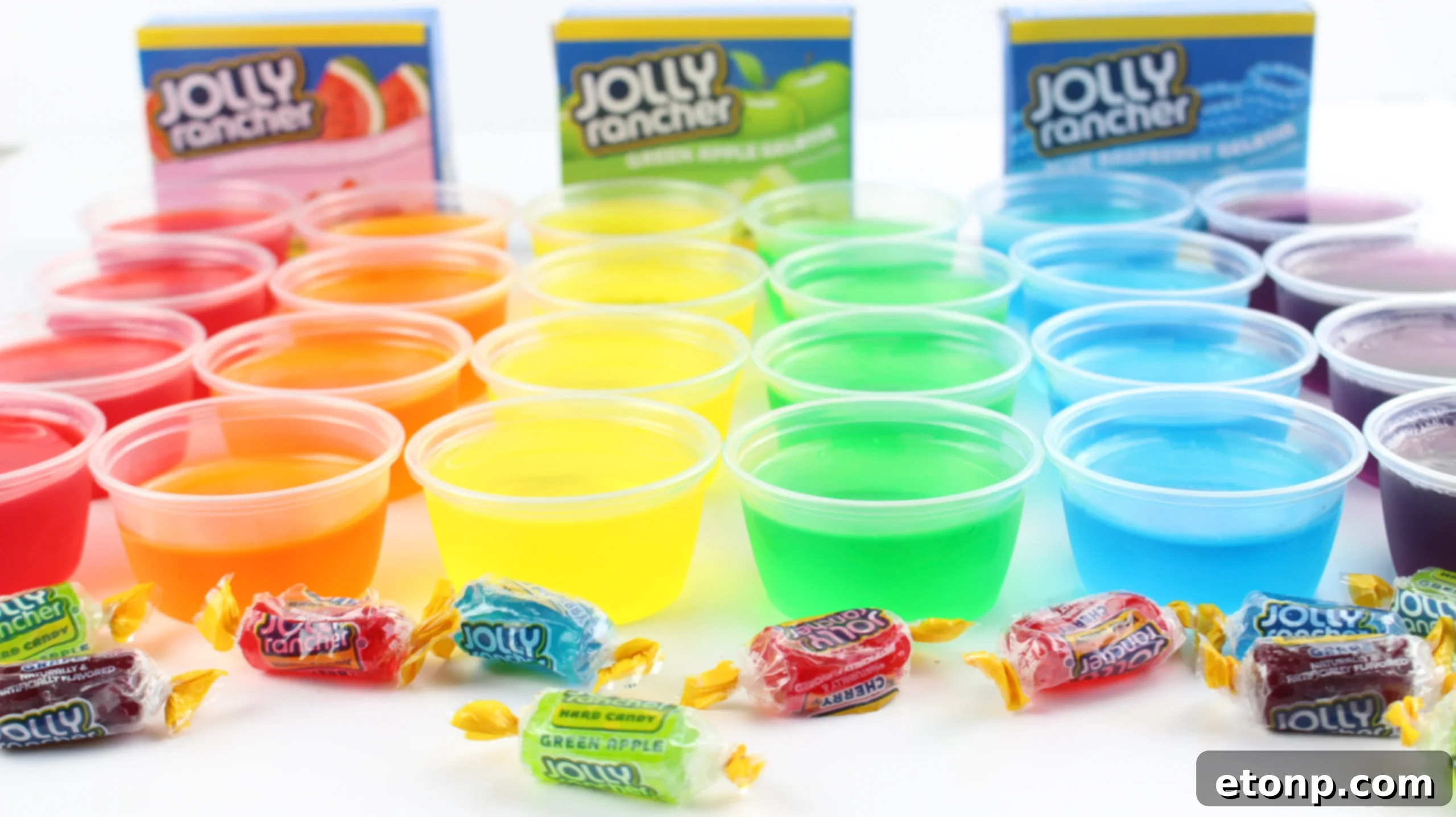Assorted vibrant Jolly Rancher Jello Shots in plastic cups, perfect for a party