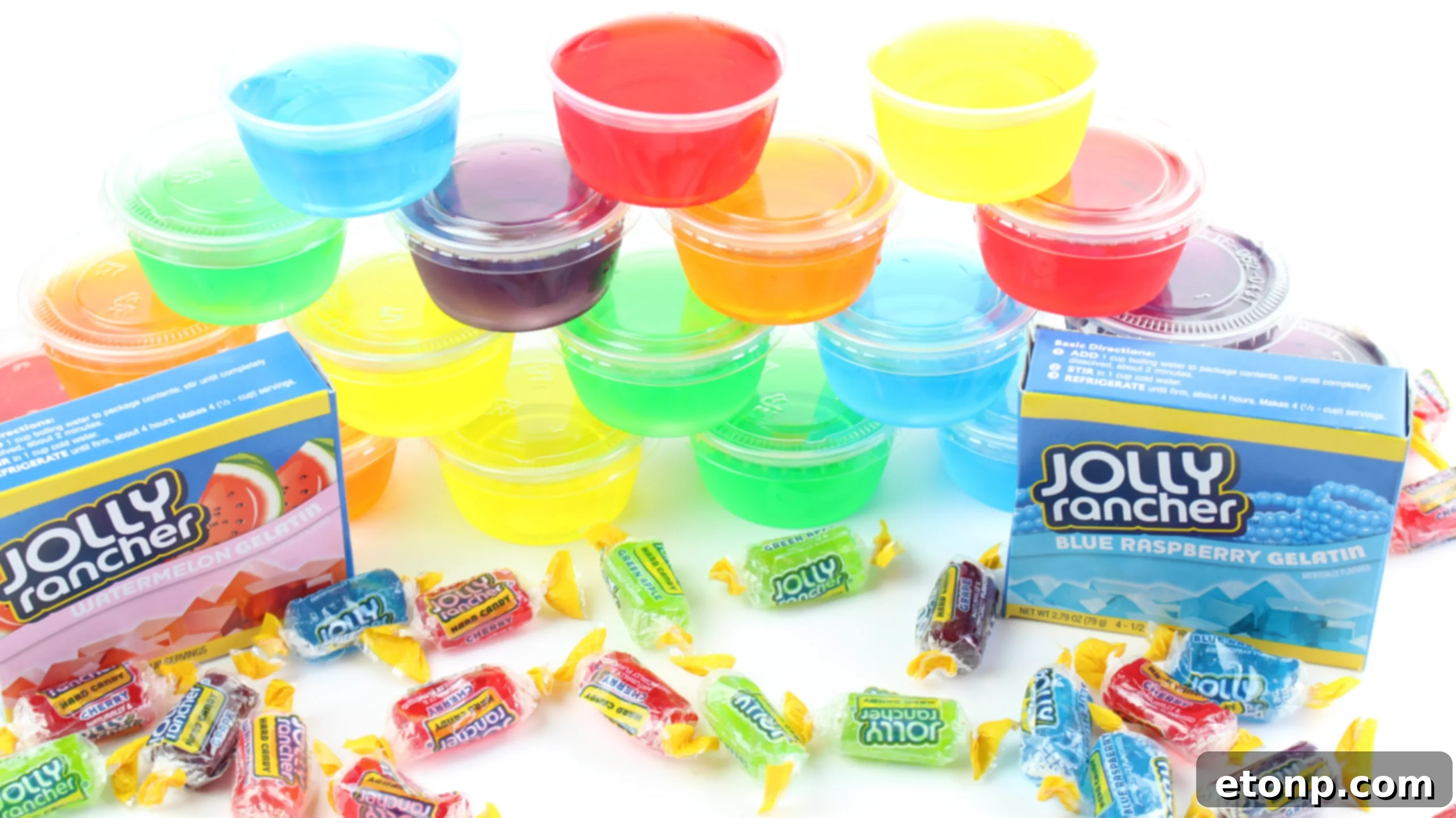 A hand reaching for a Jello Shot, demonstrating the ease of serving