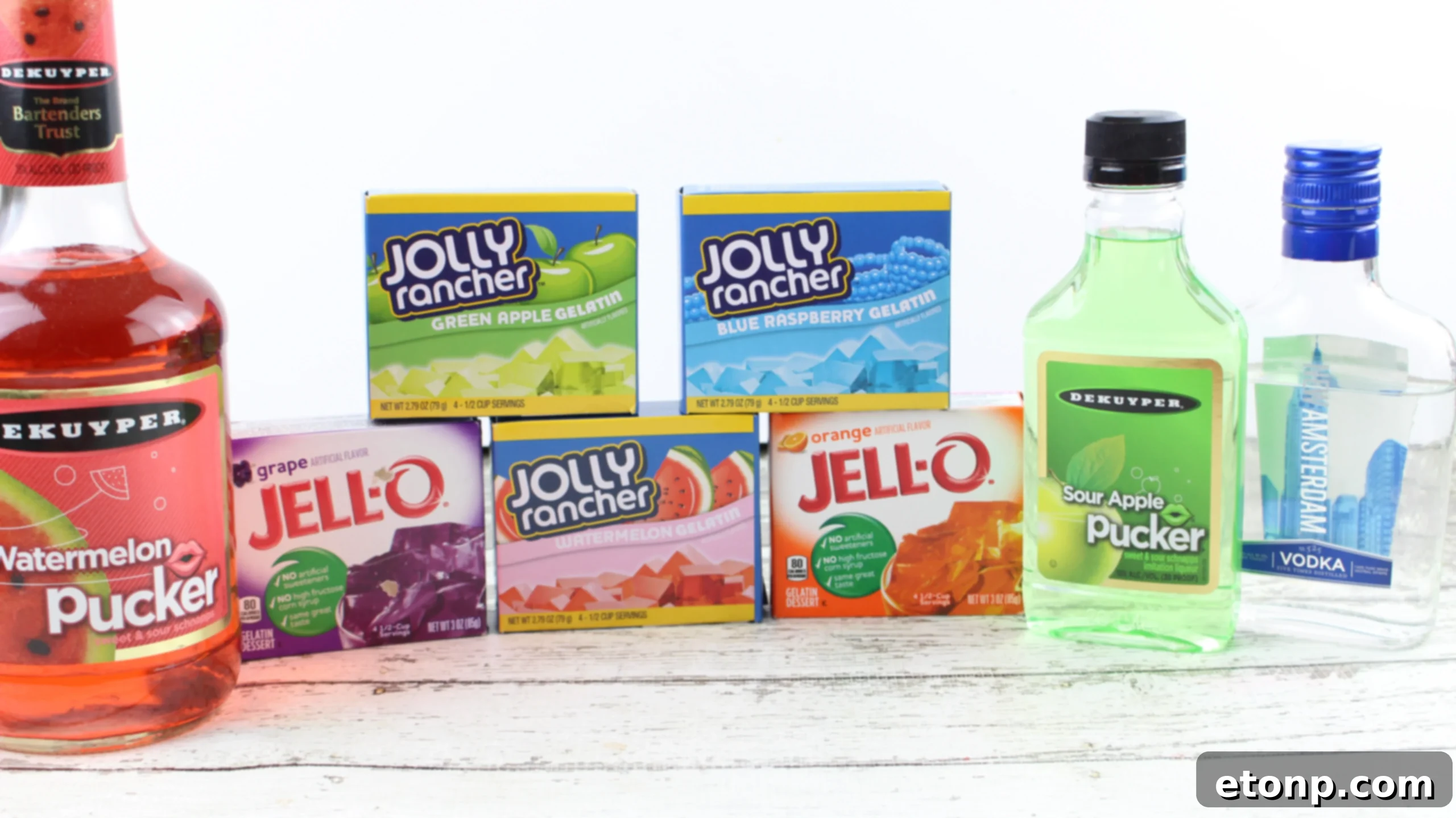 Close-up of a variety of Jolly Rancher Jello Shot flavors including grape, green apple, and blue raspberry