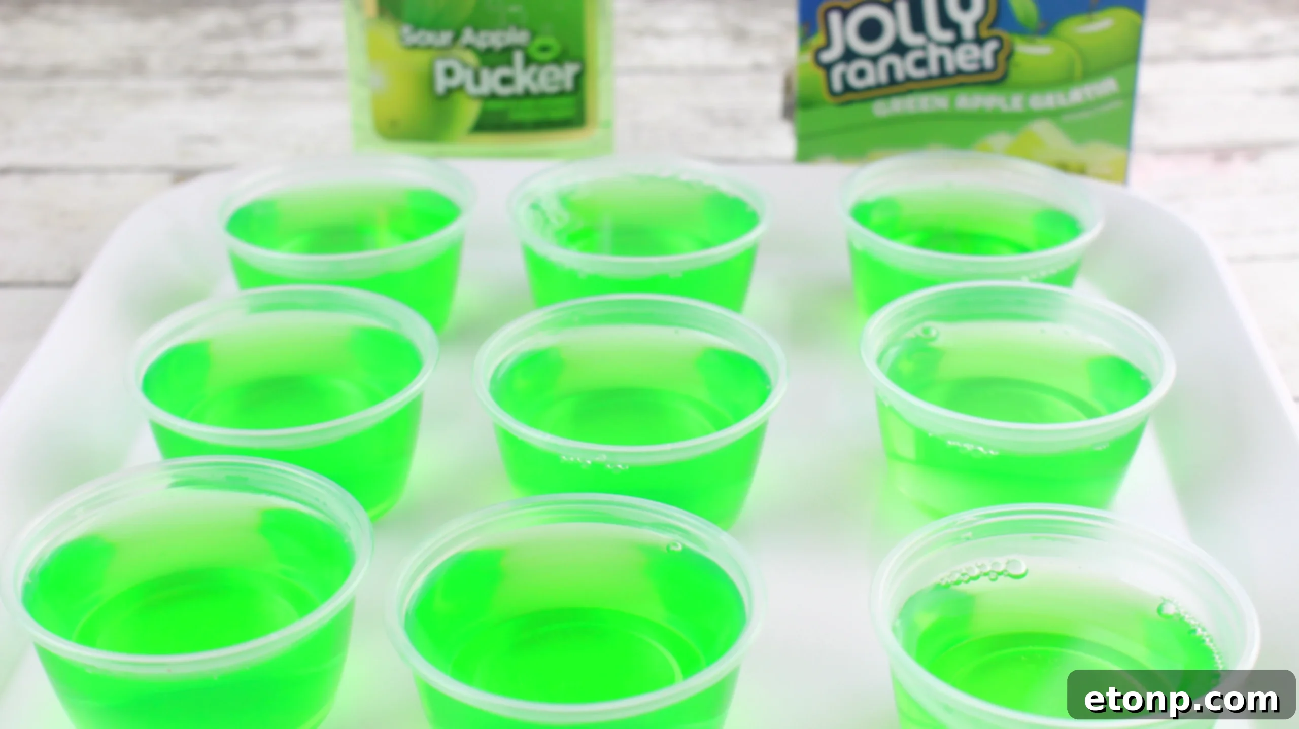 A close-up of colorful Jello Shots, showcasing their smooth, inviting texture